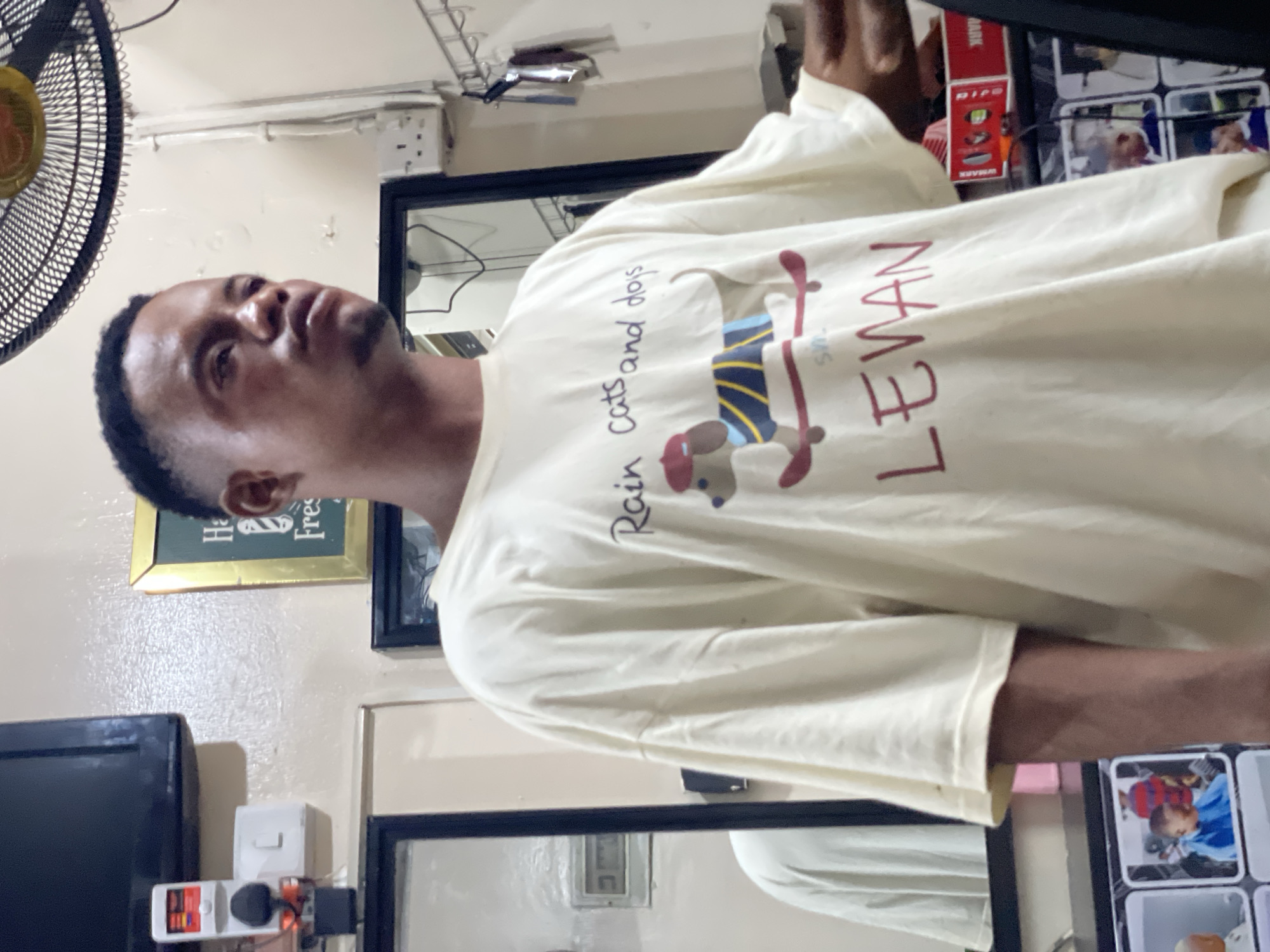 Barbershop bustles with customers getting haircuts, taking selfies in Ado