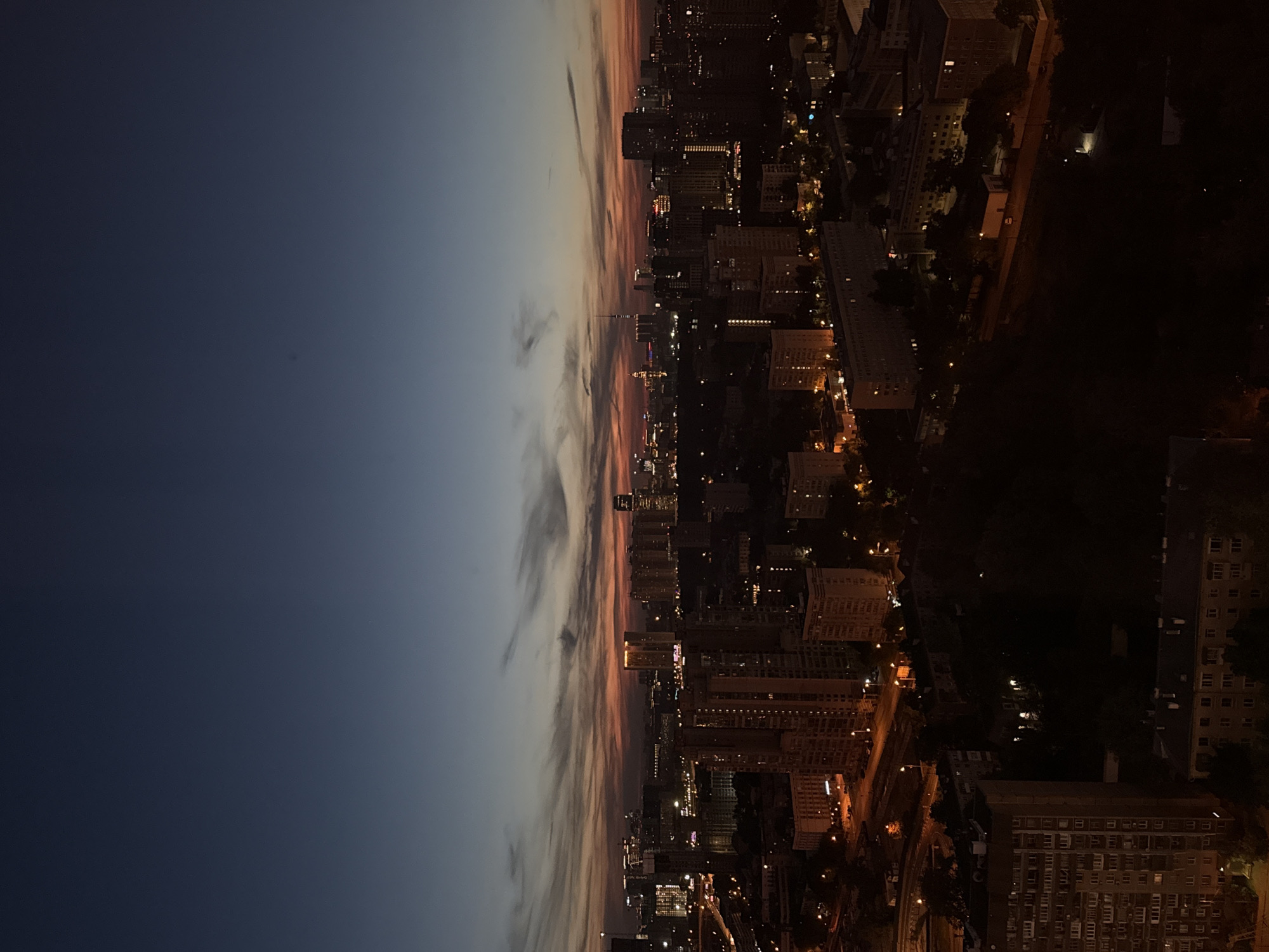 City twilight transition captured in rotated panoramic view