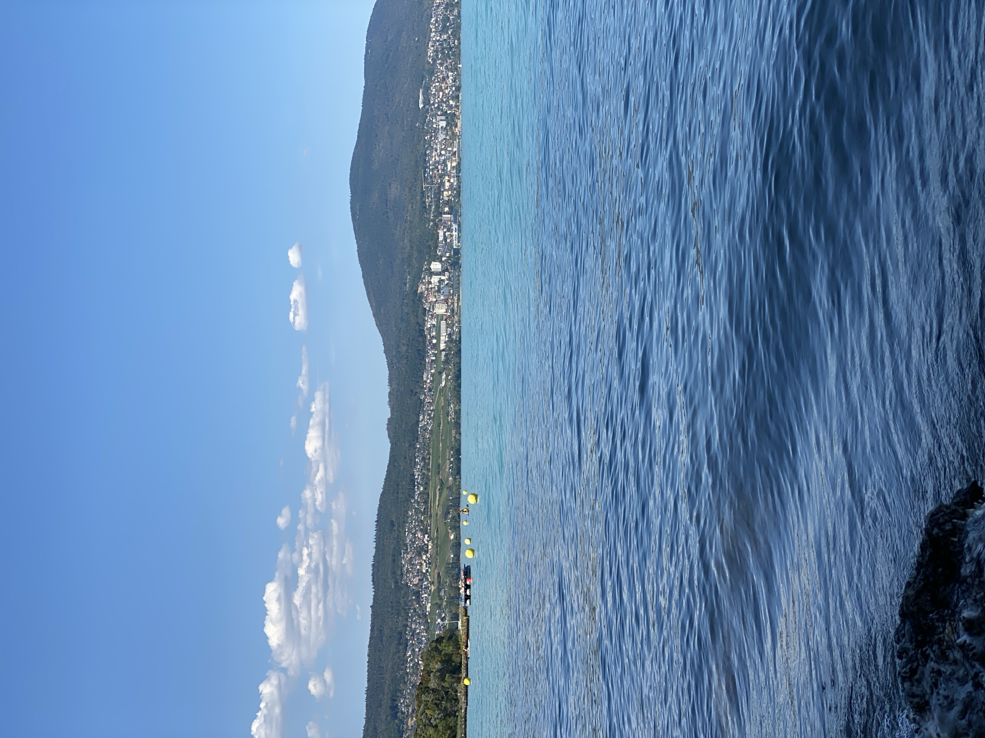 Afternoon on Lake Neuchâtel: sailboats, kayaks, and paddleboards out