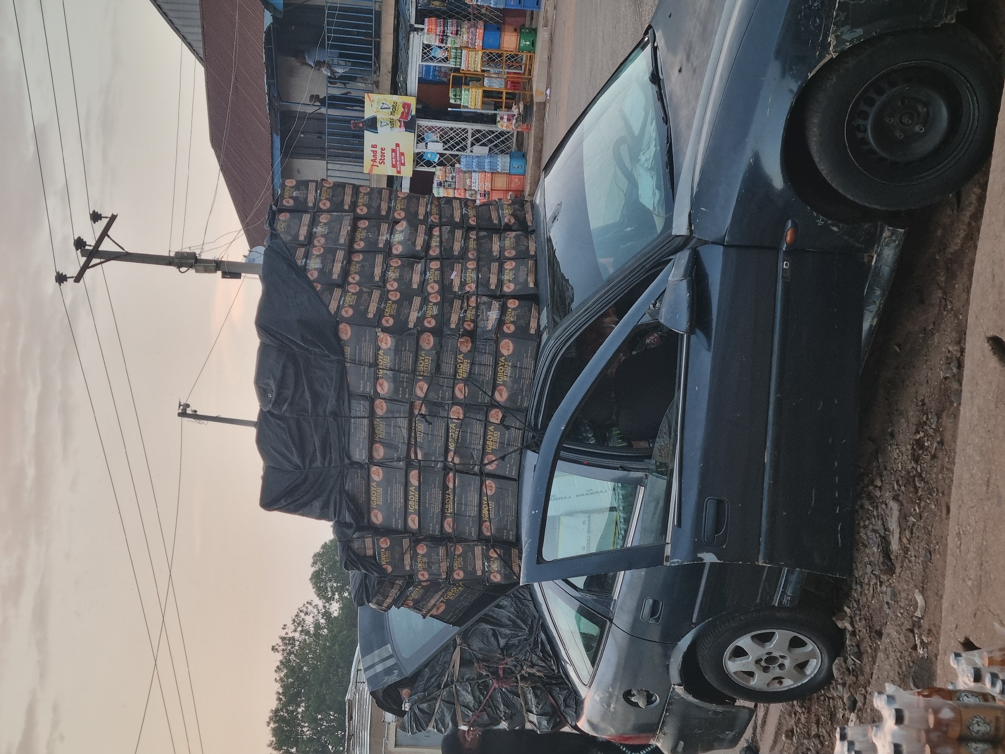 Commercial vehicles heavily loaded with goods observed in Jos, Nigeria