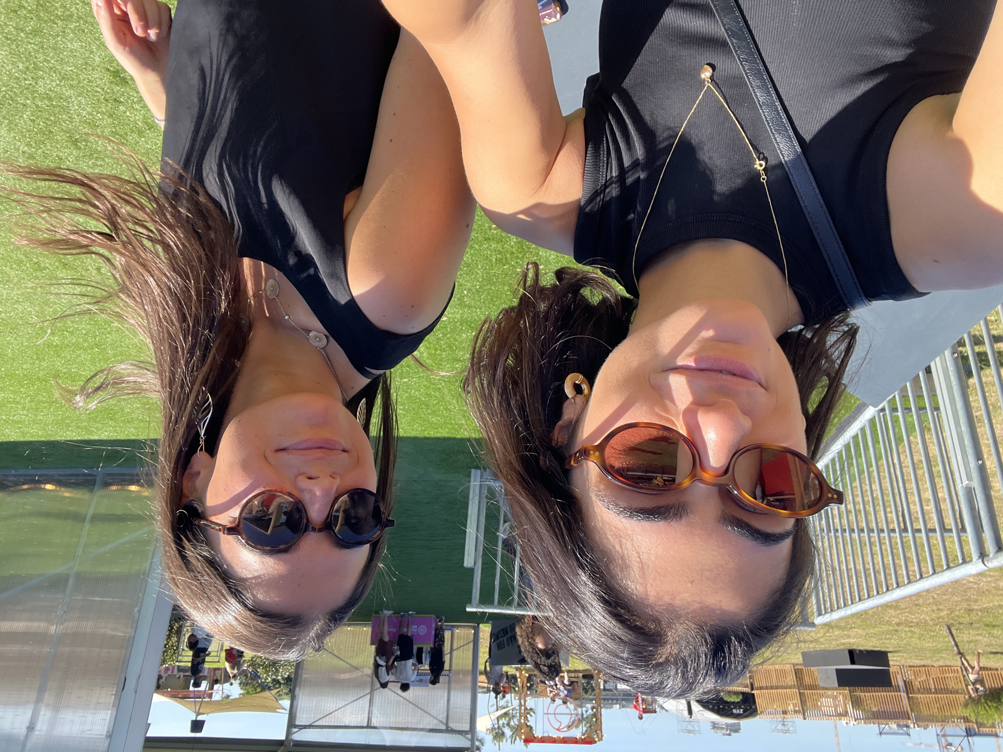 Women take selfie at outdoor festival in Porto