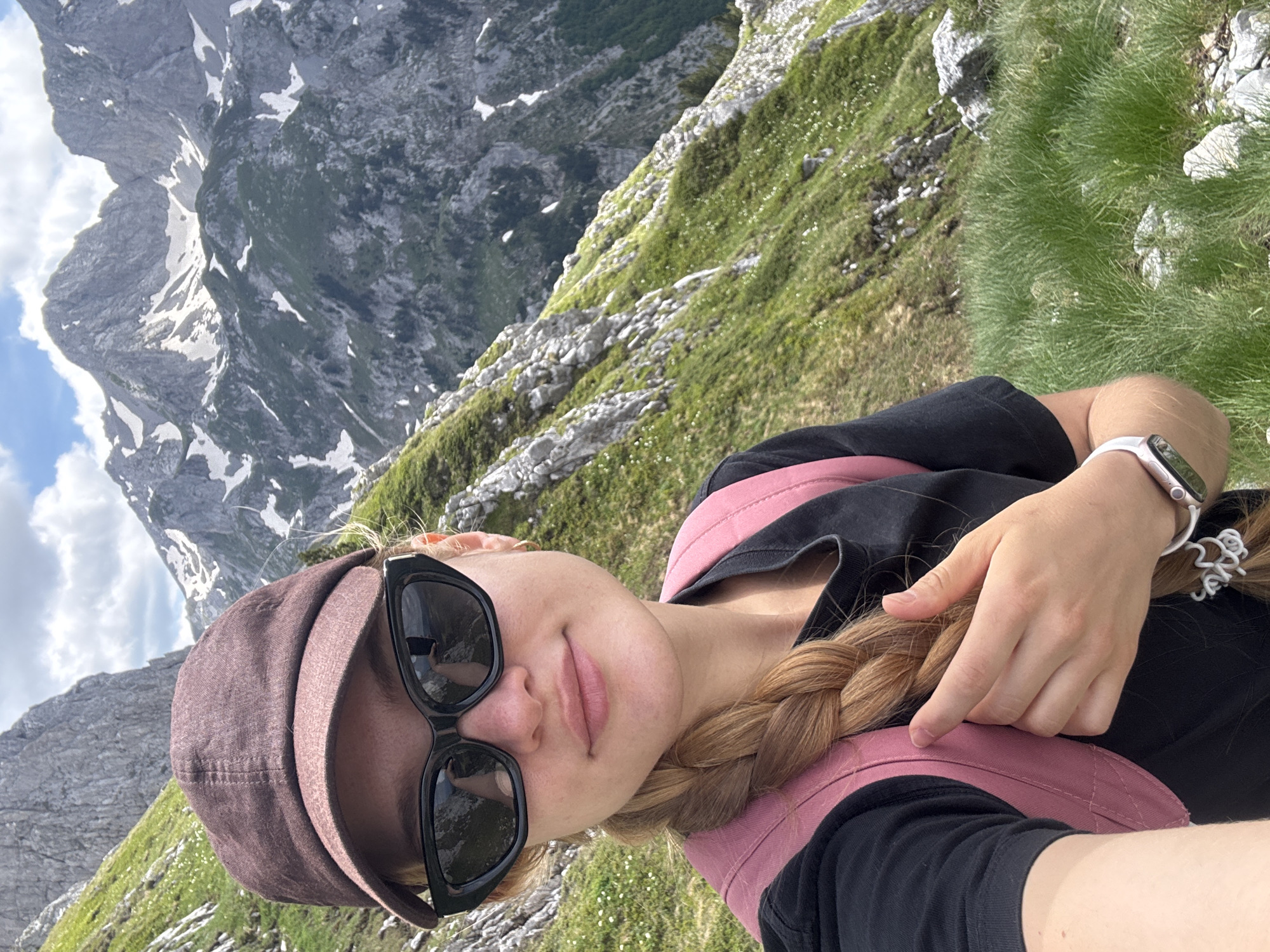 Hikers photograph mountain trek with dog near Jošanica, Montenegro