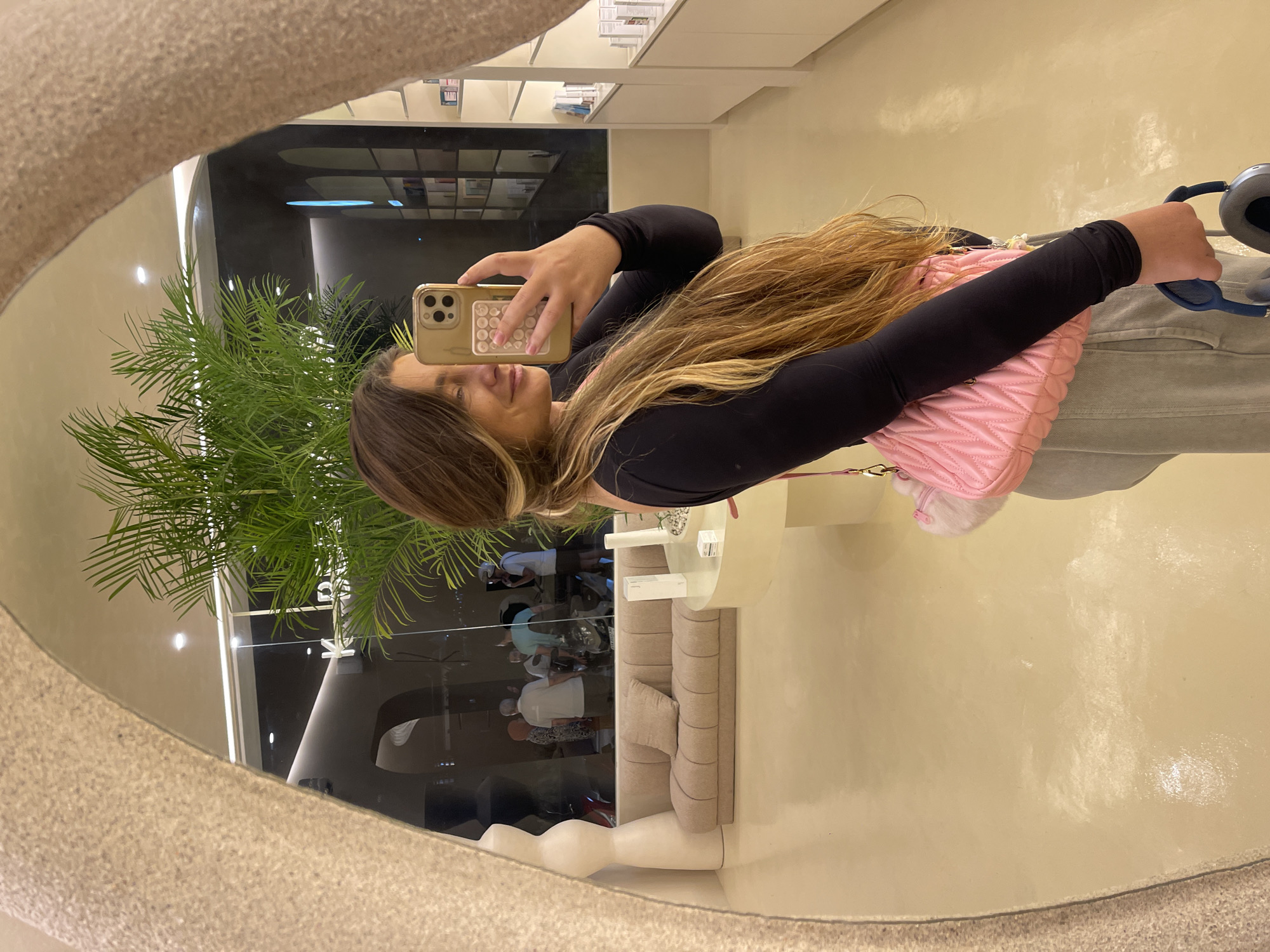 Mirror selfie session in a modern Mengwi retail space