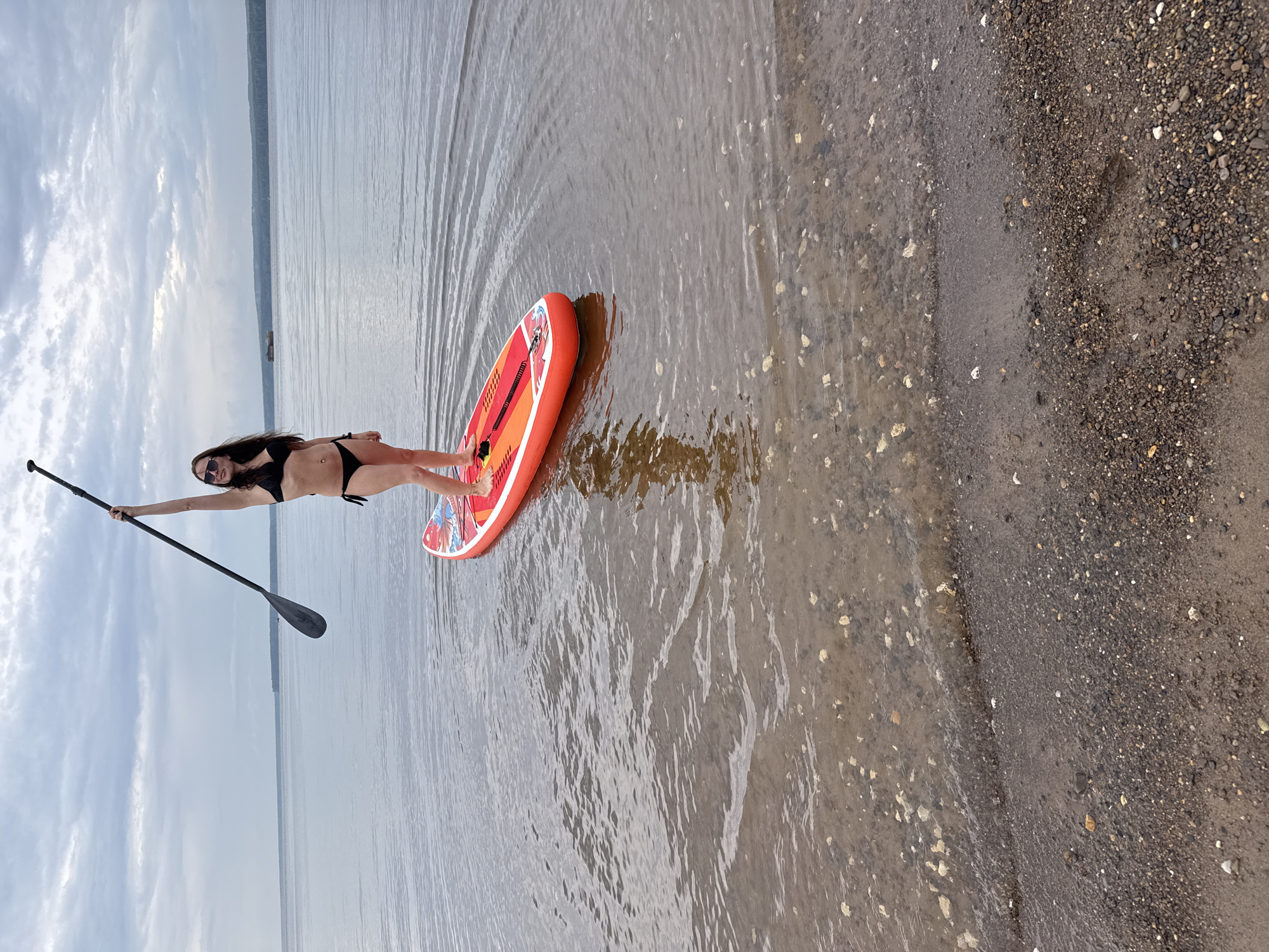 Paddleboarding and beach lounging on a Kama shore