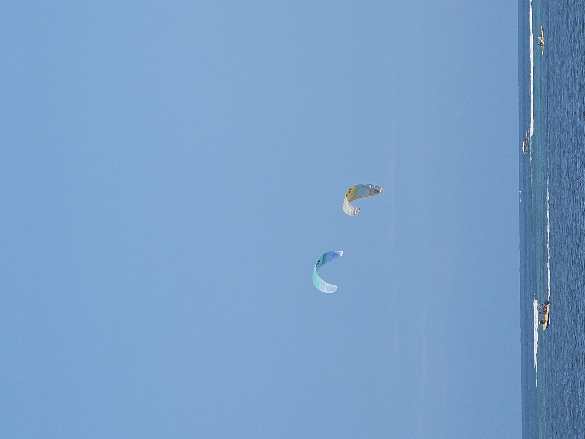 Kites, kitesurfers, and beachside massages at Sanur Beach