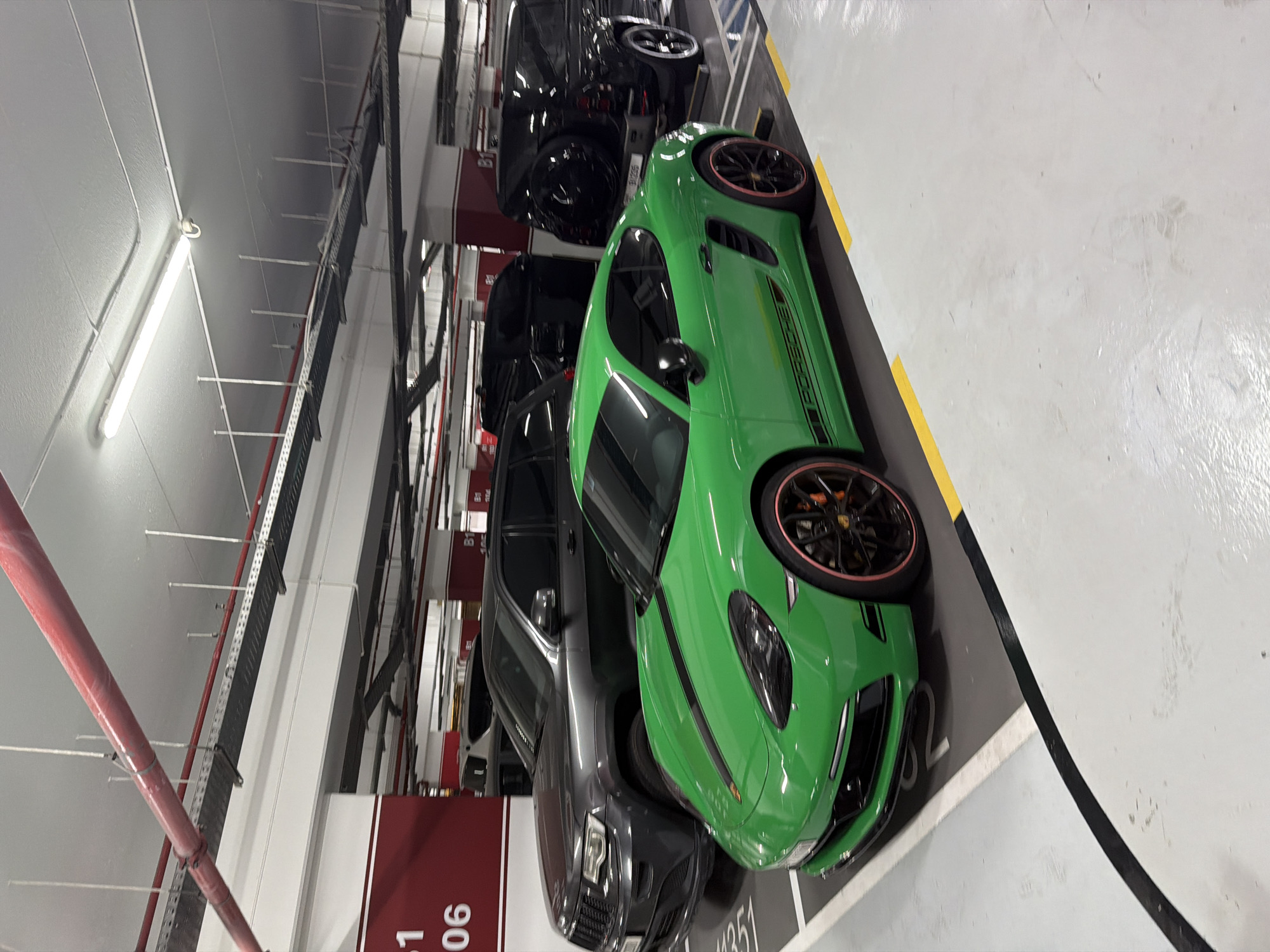 Green Porsche Cayman spotted in underground parking garage