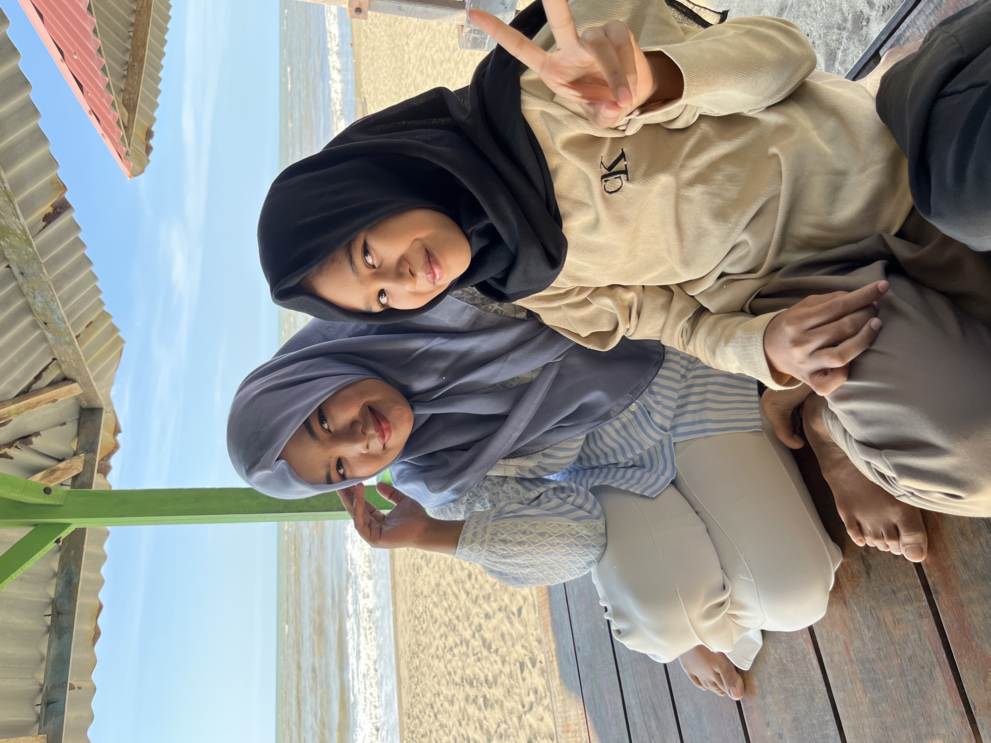 Relaxing on a sheltered wooden deck in Lhokseumawe