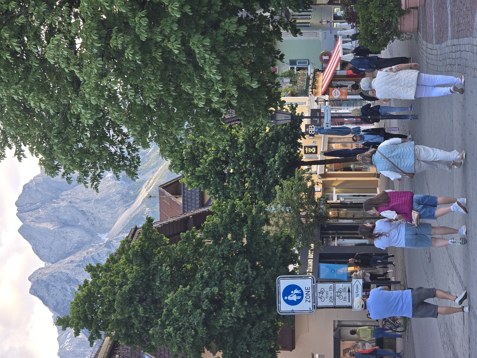 Tourist documents evening stroll through Garmisch-Partenkirchen town center