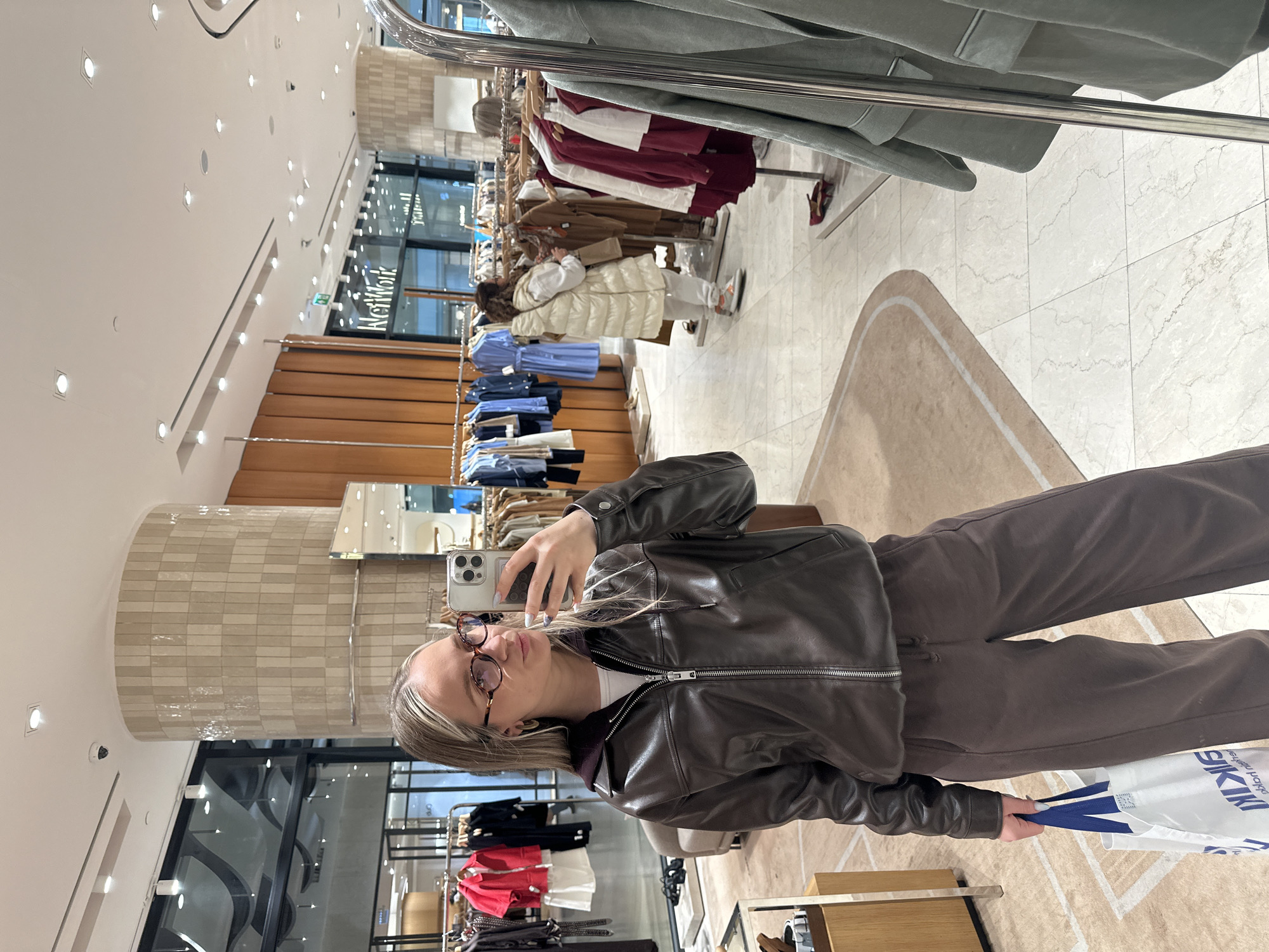 Woman takes selfies while shopping at Esenyurt mall