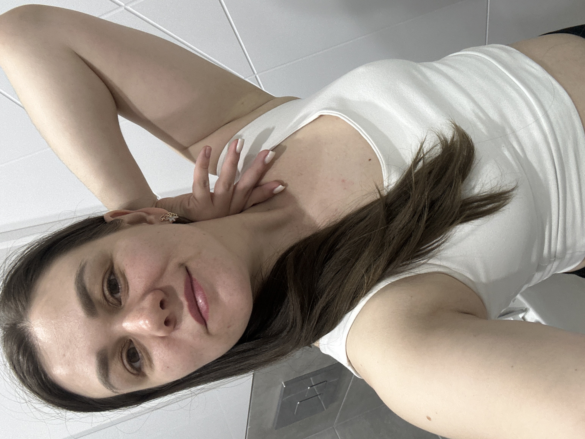 Woman takes selfies in bathroom in Chaikovsky, Russia