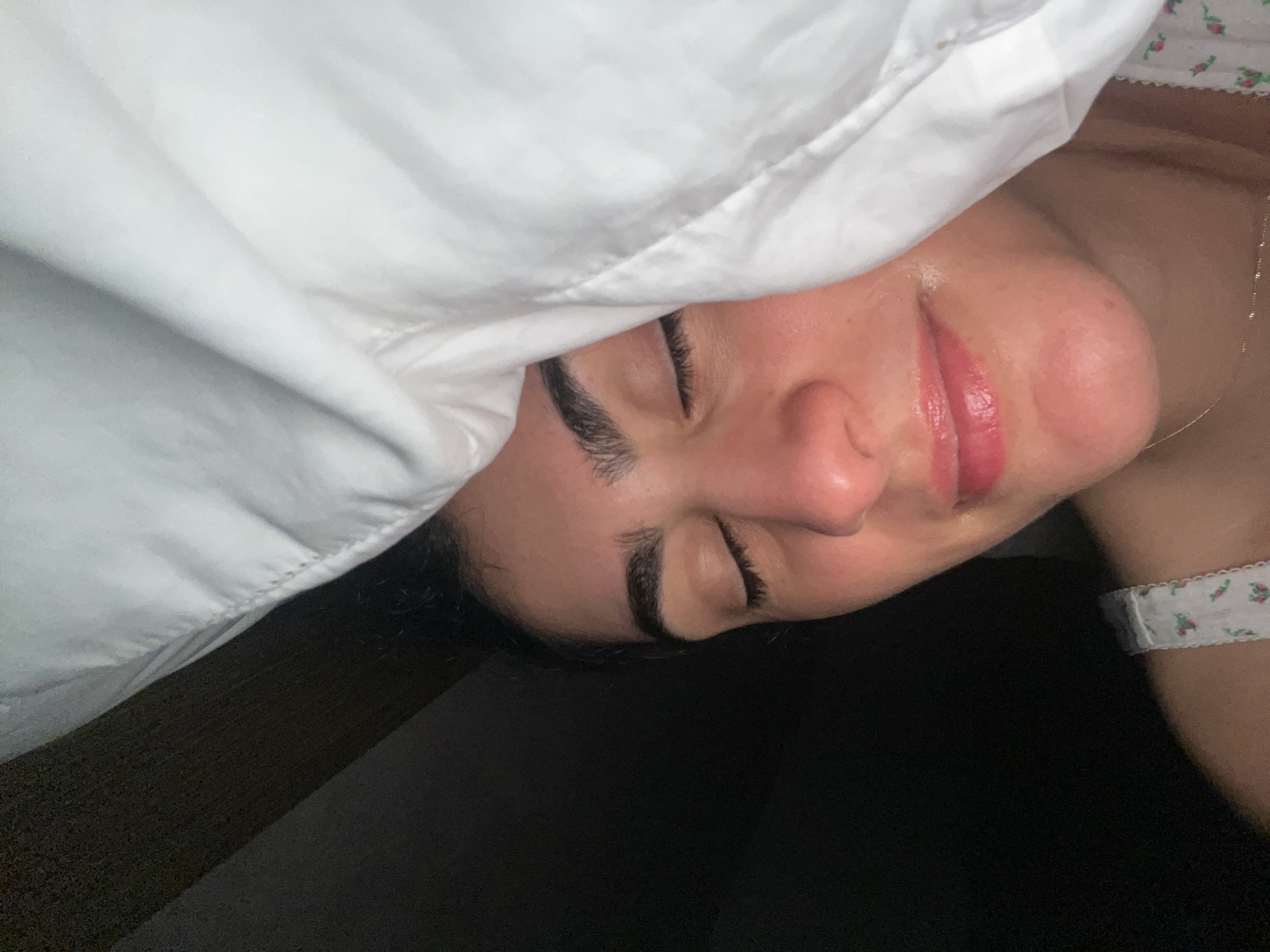 Person rests with closed eyes in Miami Beach