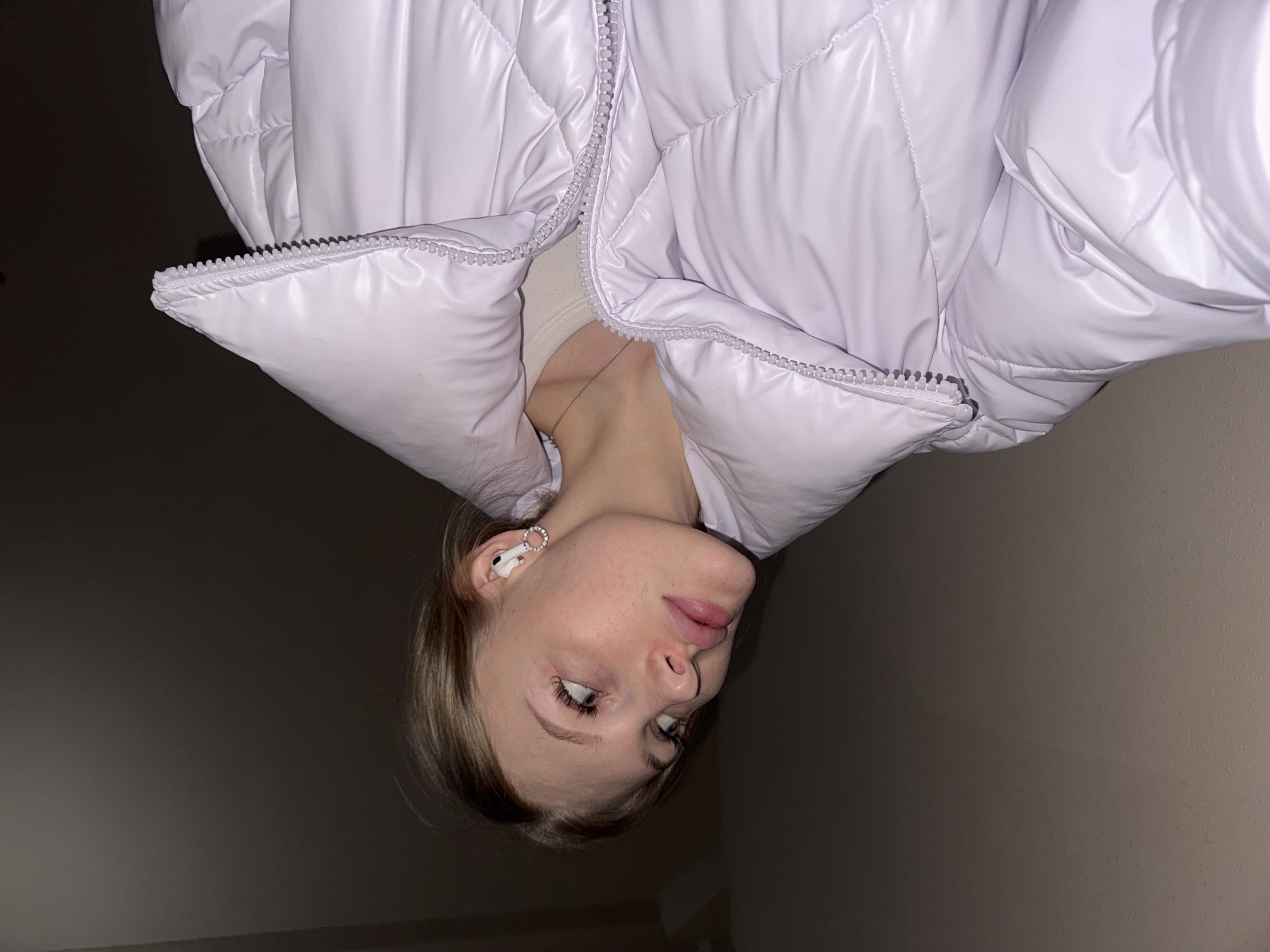 Woman takes multiple selfies indoors in Perm, Russia