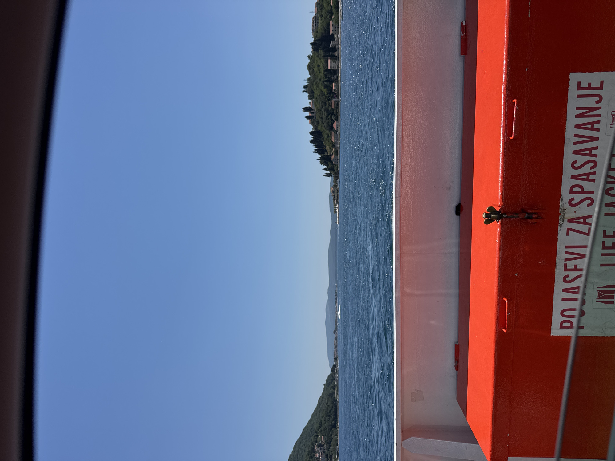 Ferry crossing along Montenegro's forested Adriatic coast