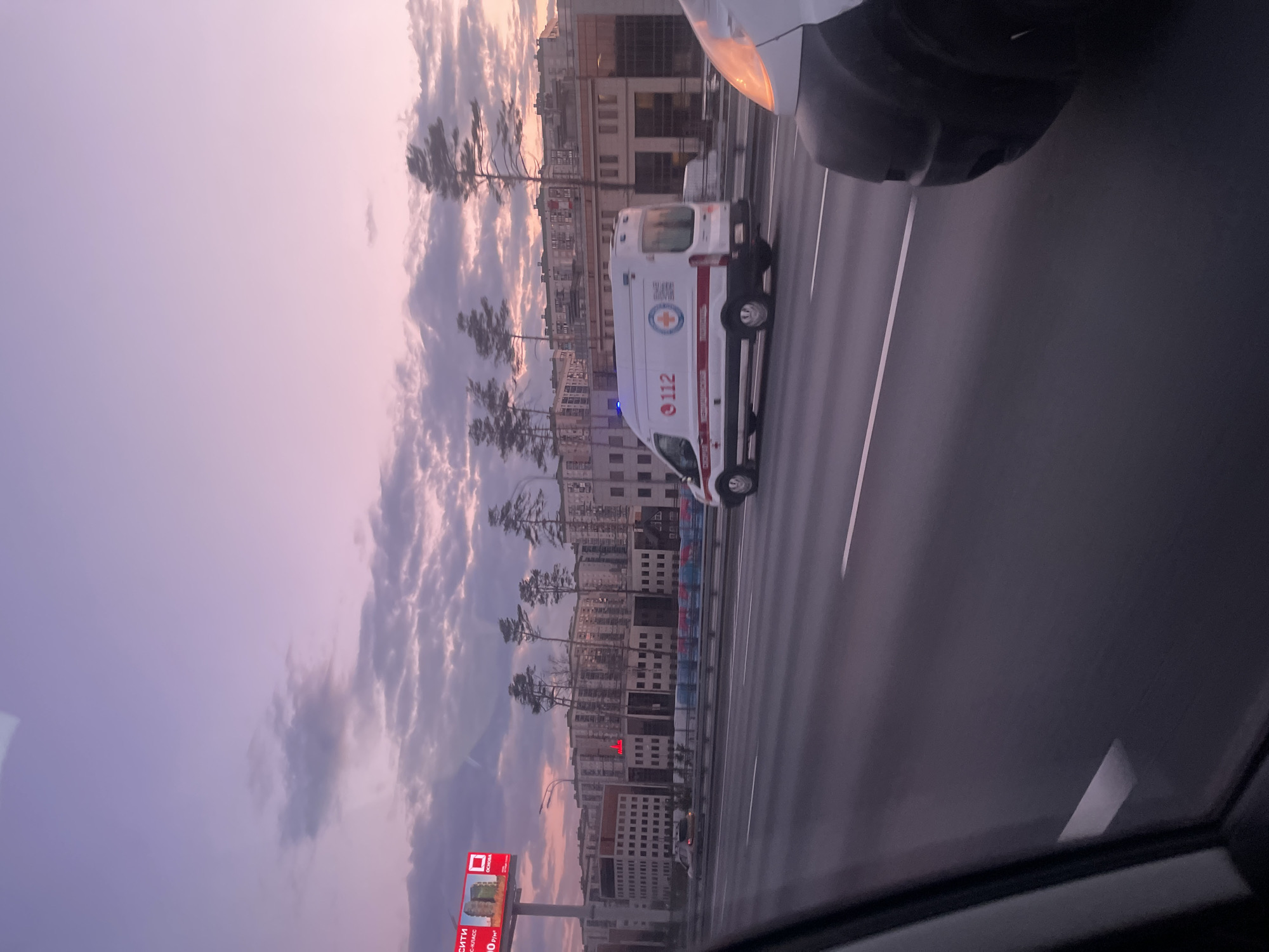 Emergency ambulance responds in Khimki, Russia during evening hours