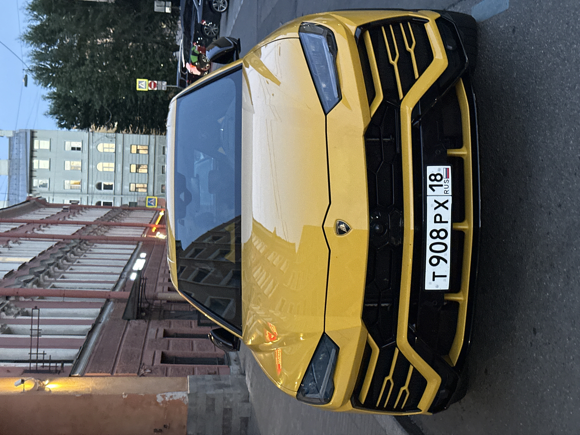 Yellow Lamborghini and a dimly lit Saint Petersburg interior, one evening.