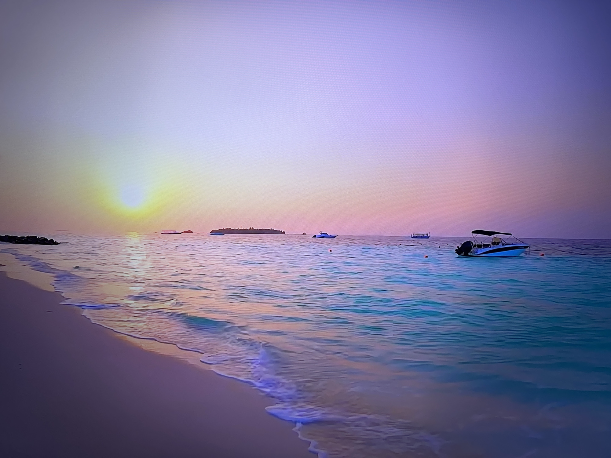 Sunset beach and an England football match on TV