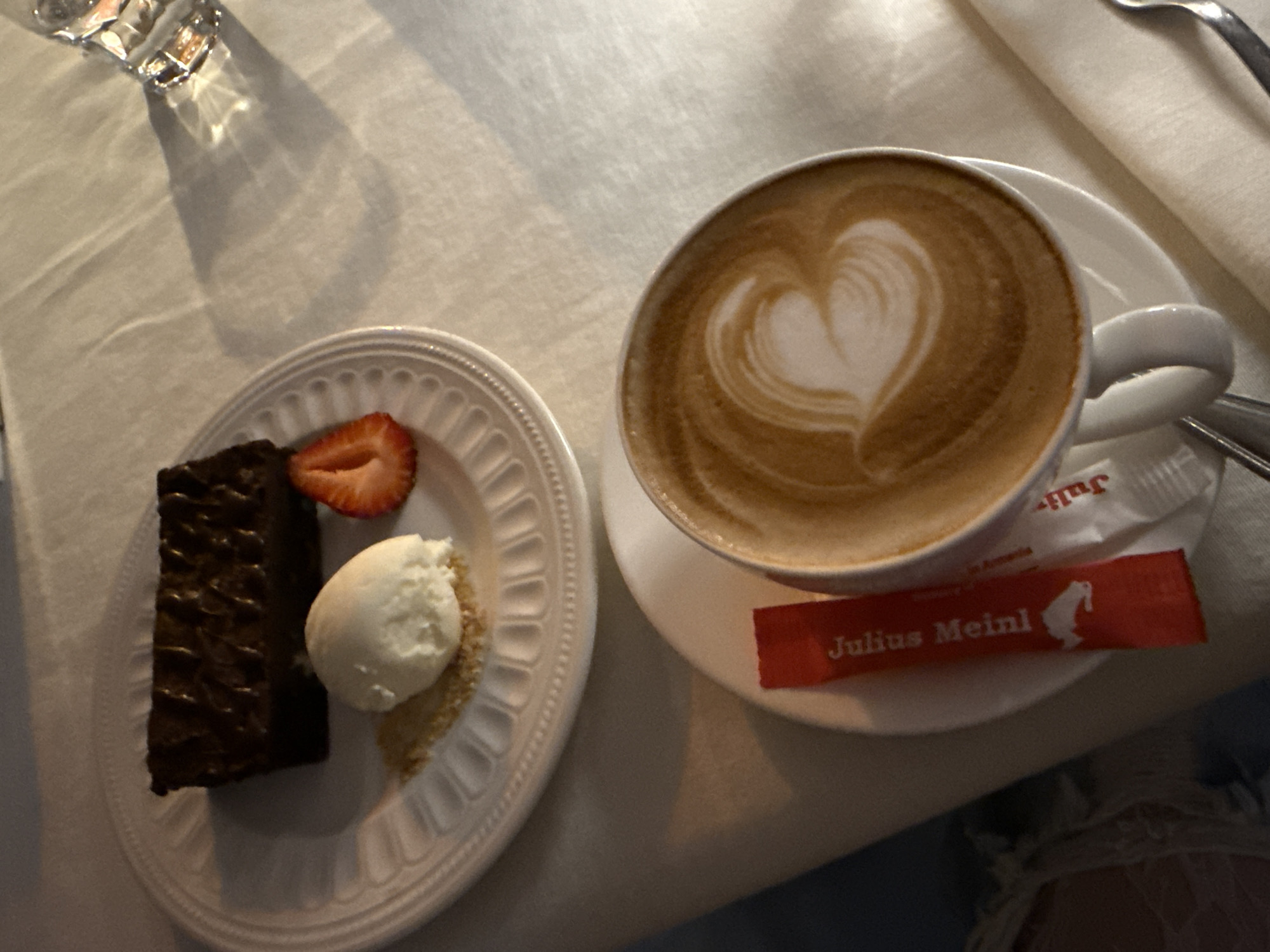 Urban afternoon: cafe dessert, mural building, street performer entertainment