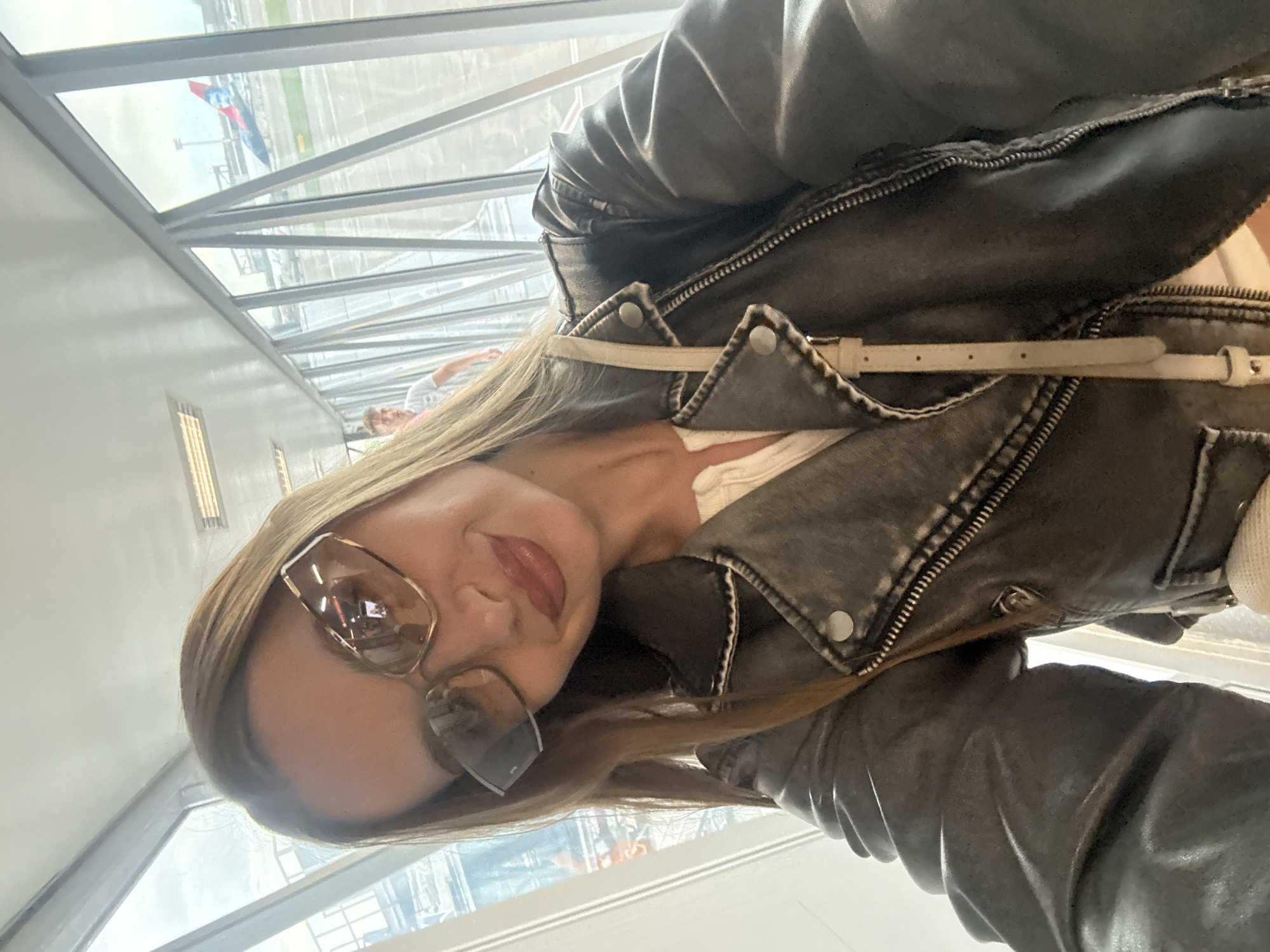 Woman spotted at Belgrade airport terminal wearing grey jacket