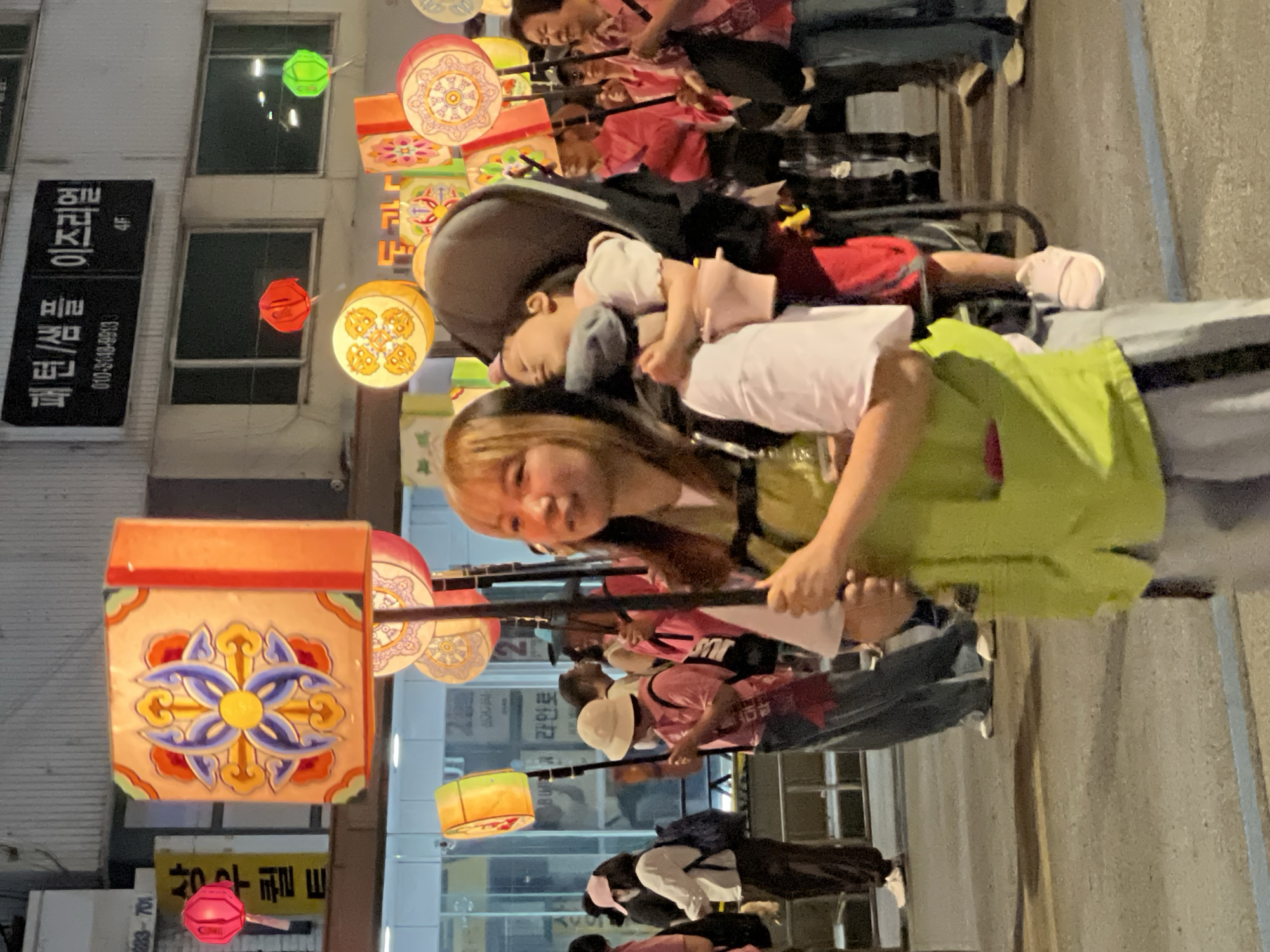 Lantern procession moves through Seoul streets with families participating