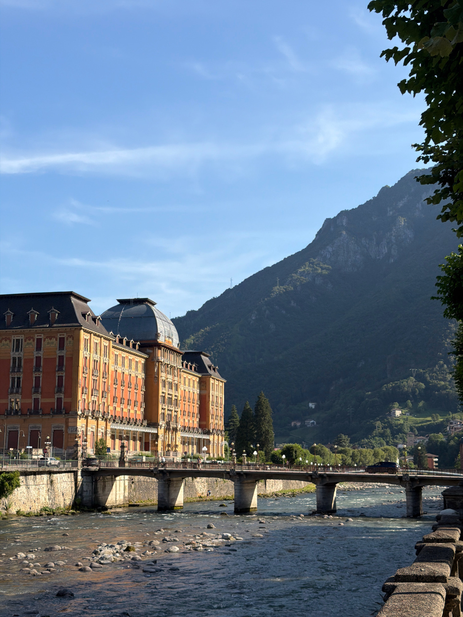 San Pellegrino Terme's riverside, fountain, and grand Casino