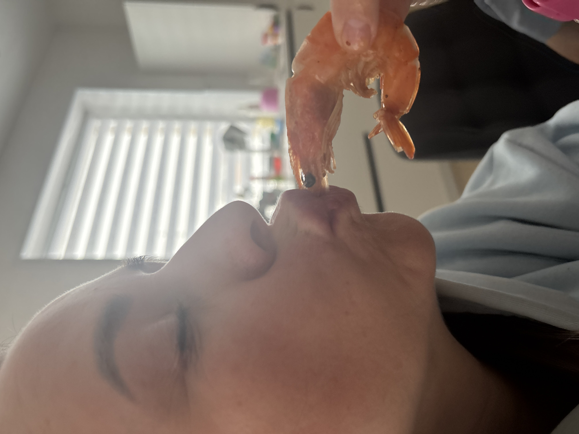 Indoor family gathering captured in Chaikovsky includes shrimp meal