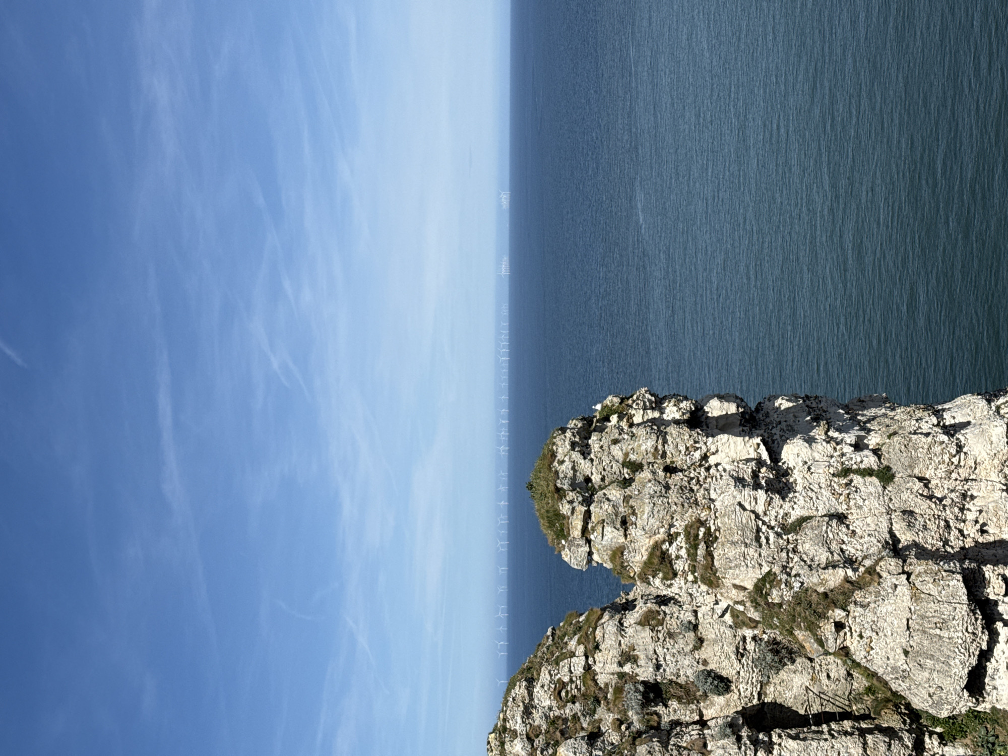 Offshore wind farm photographed from Étretat cliffs, France