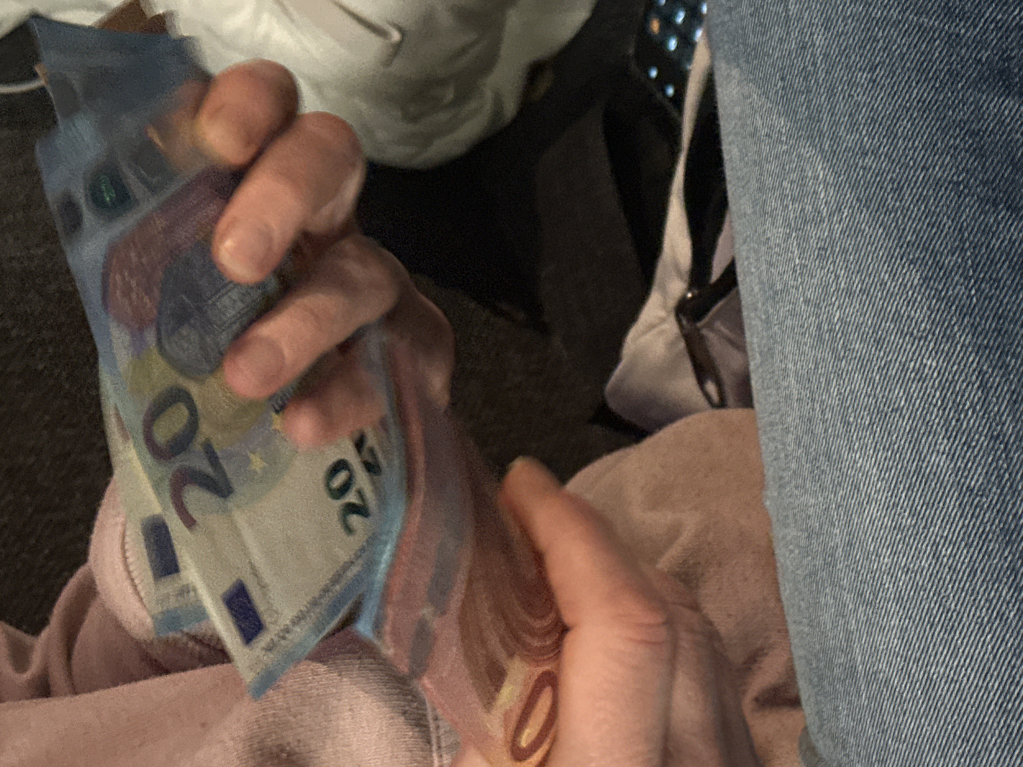 Person holds stack of Euro bills in Varna