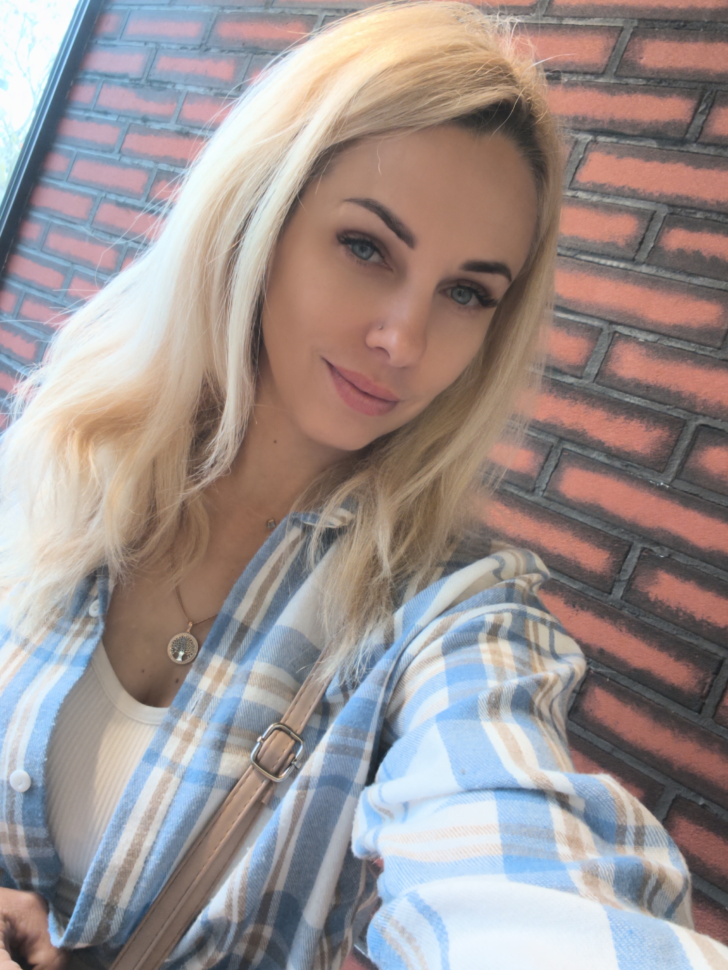 Woman poses with fresh strawberries in Sevastopol selfie session