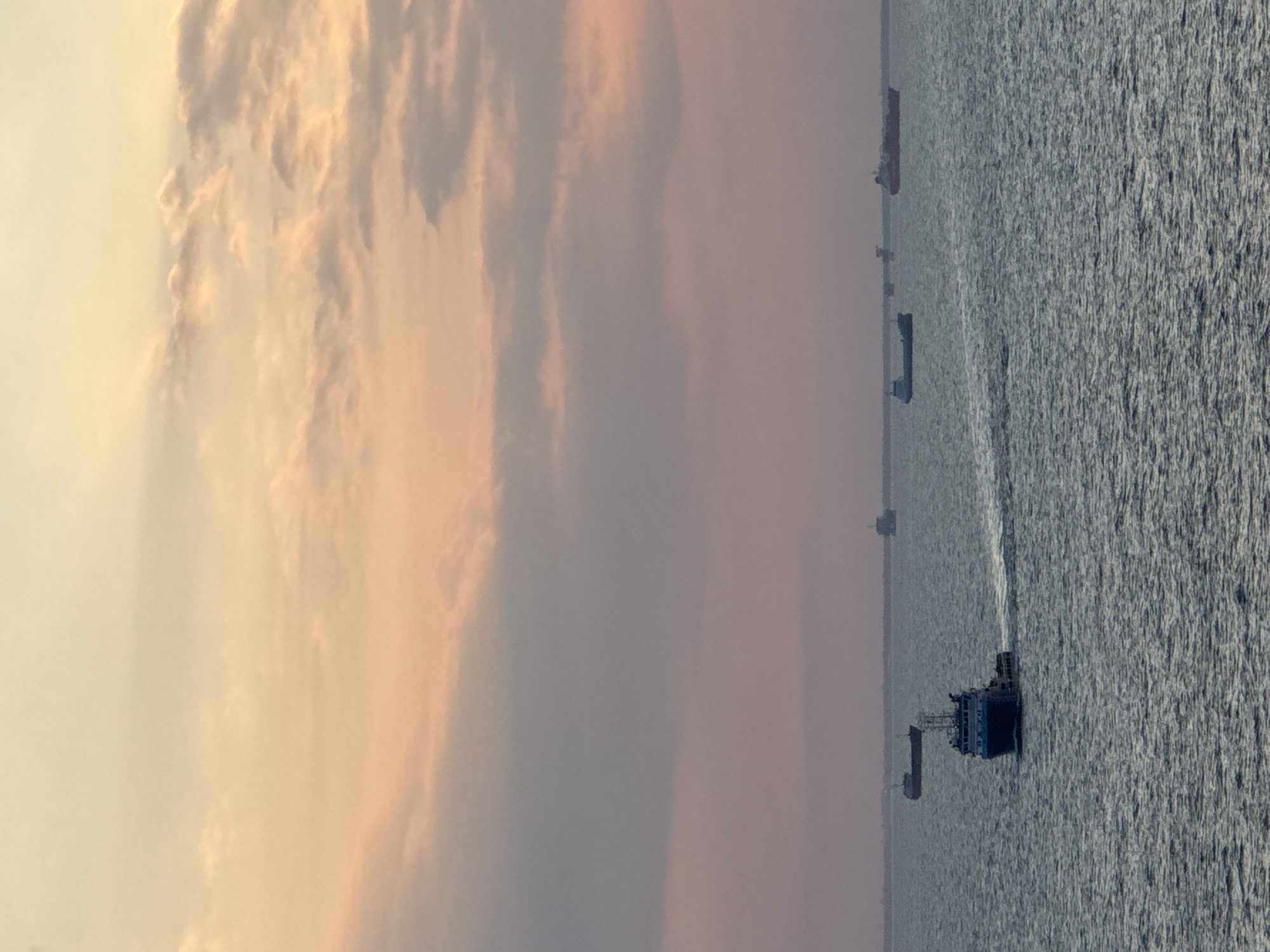 Maritime industrial activity observed off Italian coast during sunset