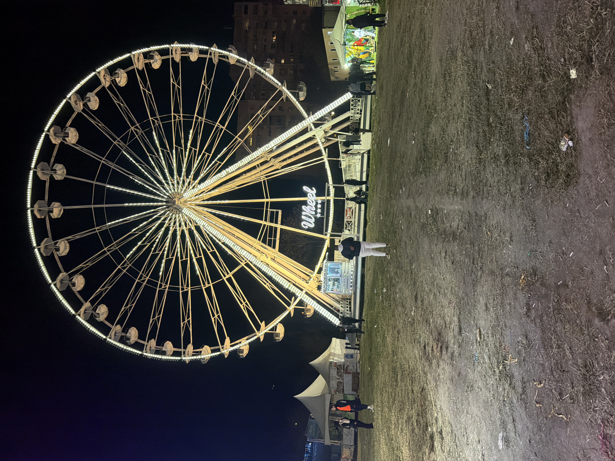 Nighttime carnival operates with illuminated rides in Plovdiv, Bulgaria