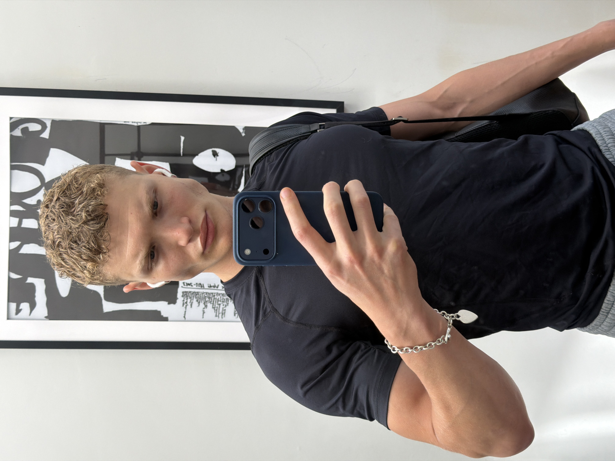 Young man takes mirror selfie in London