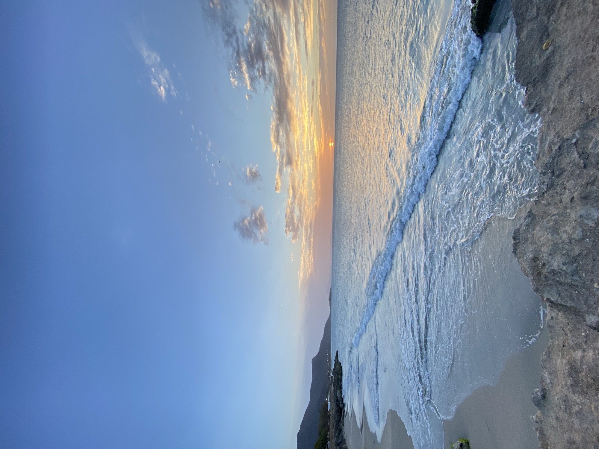 Sunset observed over calm ocean at Juan Griego, Venezuela