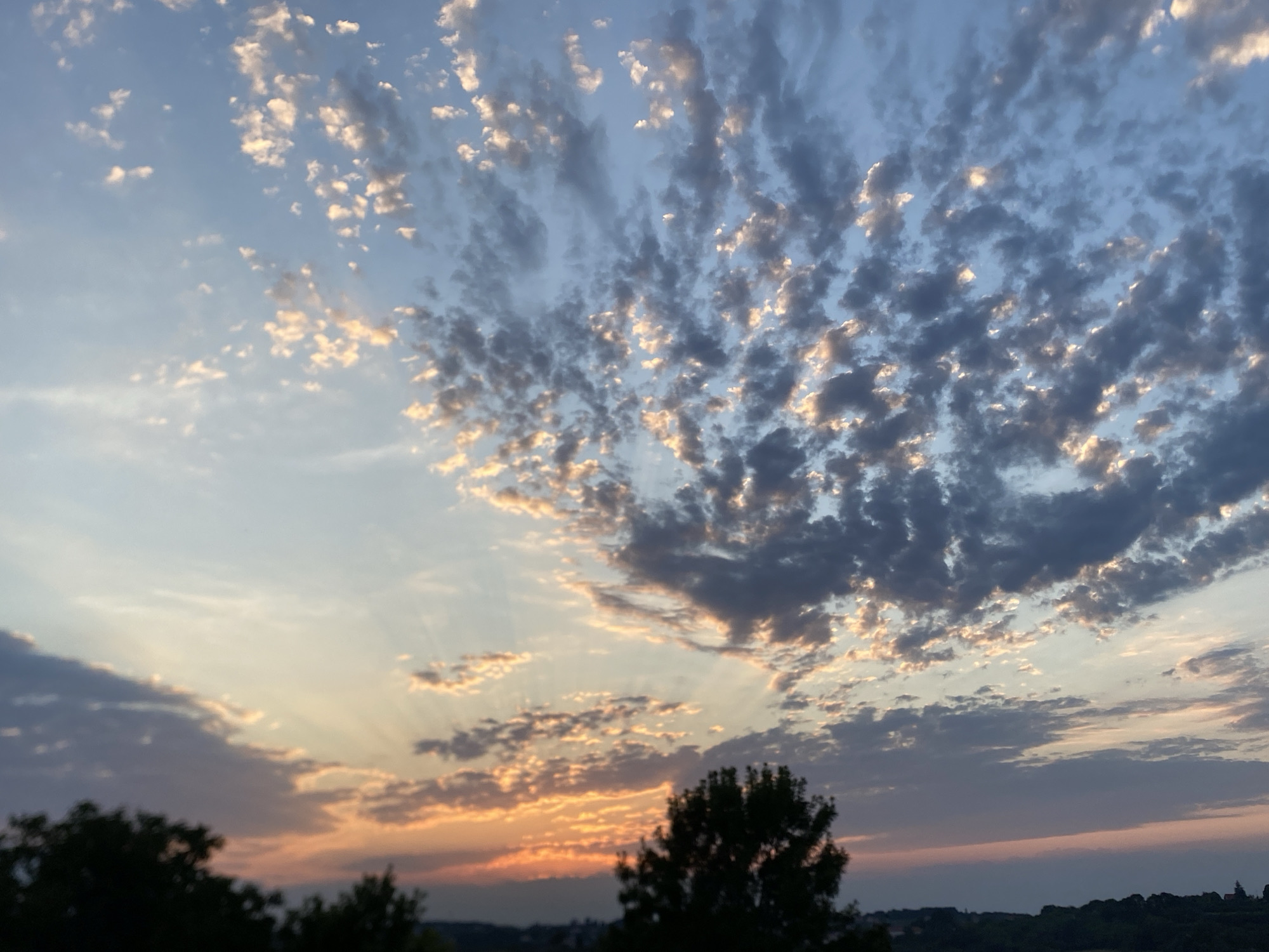 Sunset and open windows in a Serbian evening.