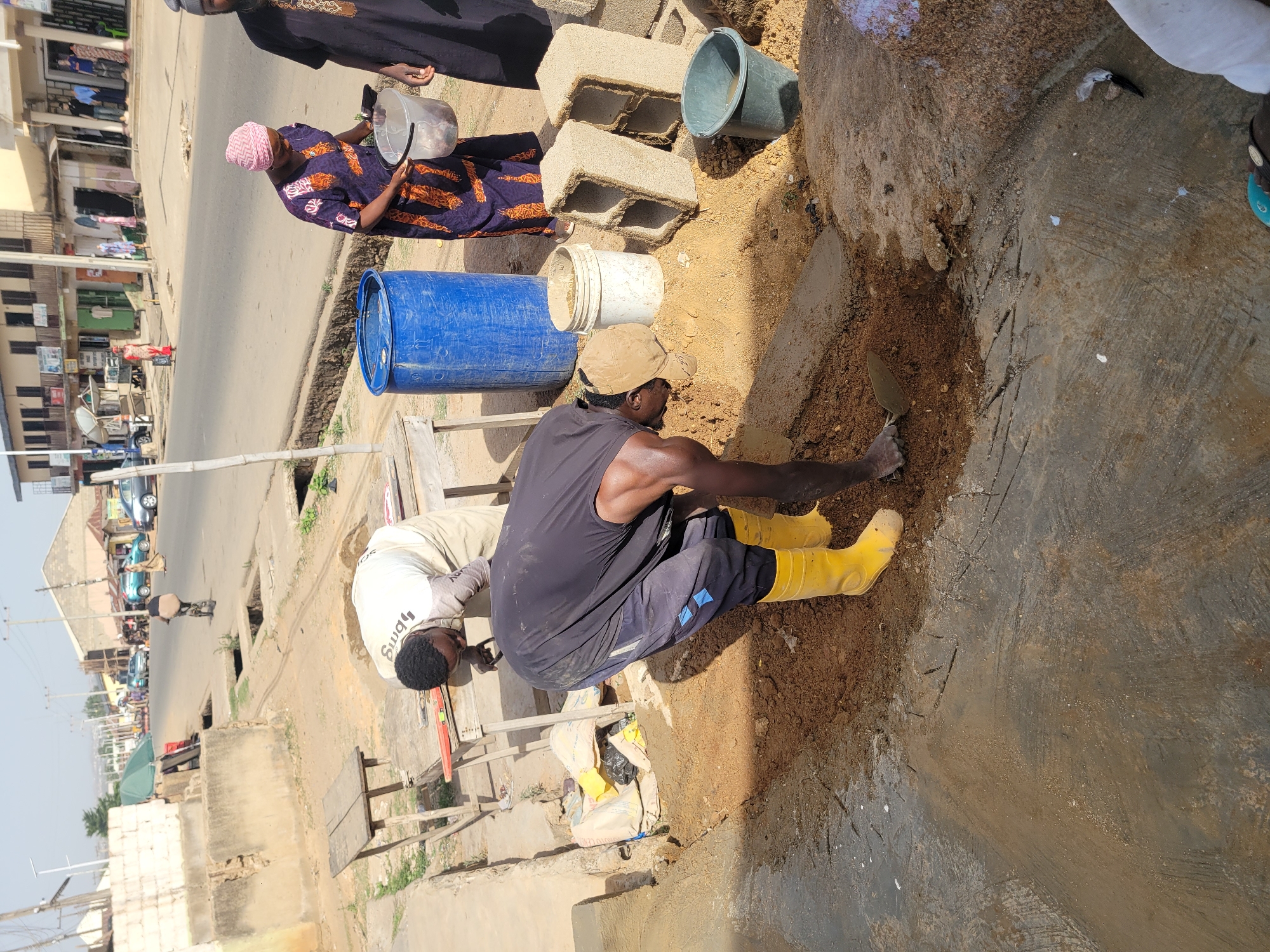Construction workers renovate building in Jos, Nigeria