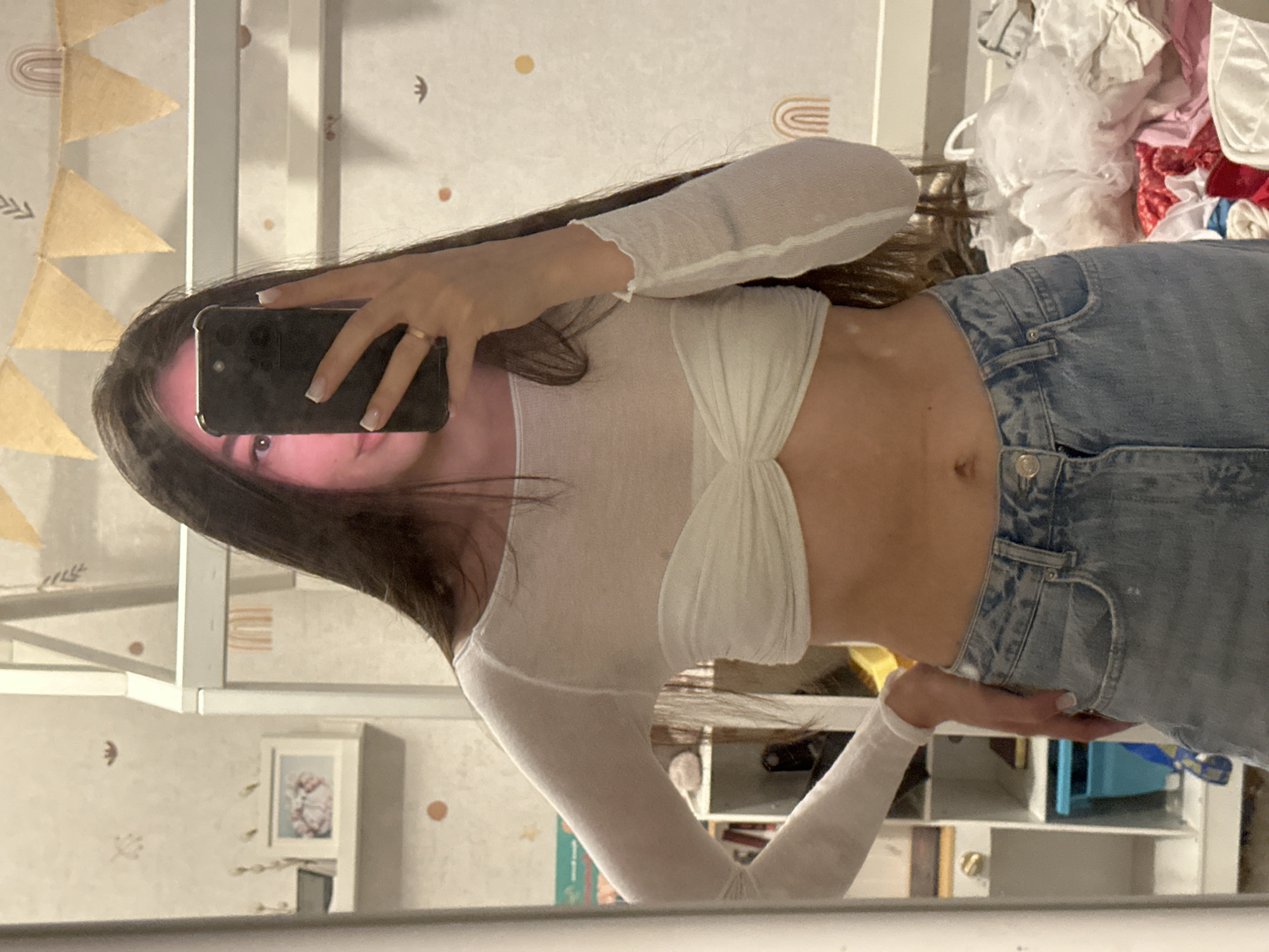 Woman takes mirror selfie in Berezovka, Russia