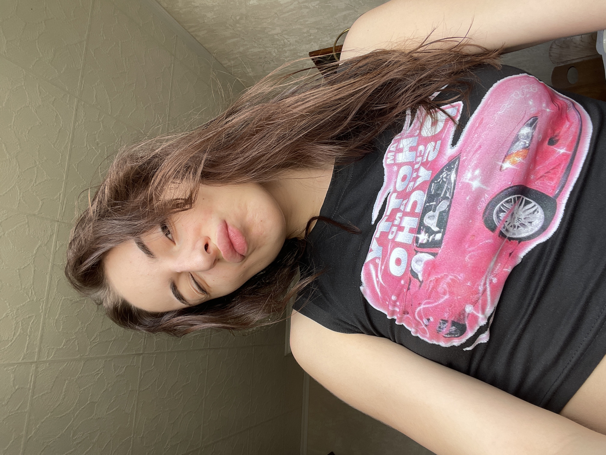 Woman photographed indoors wearing graphic t-shirt in Moscow