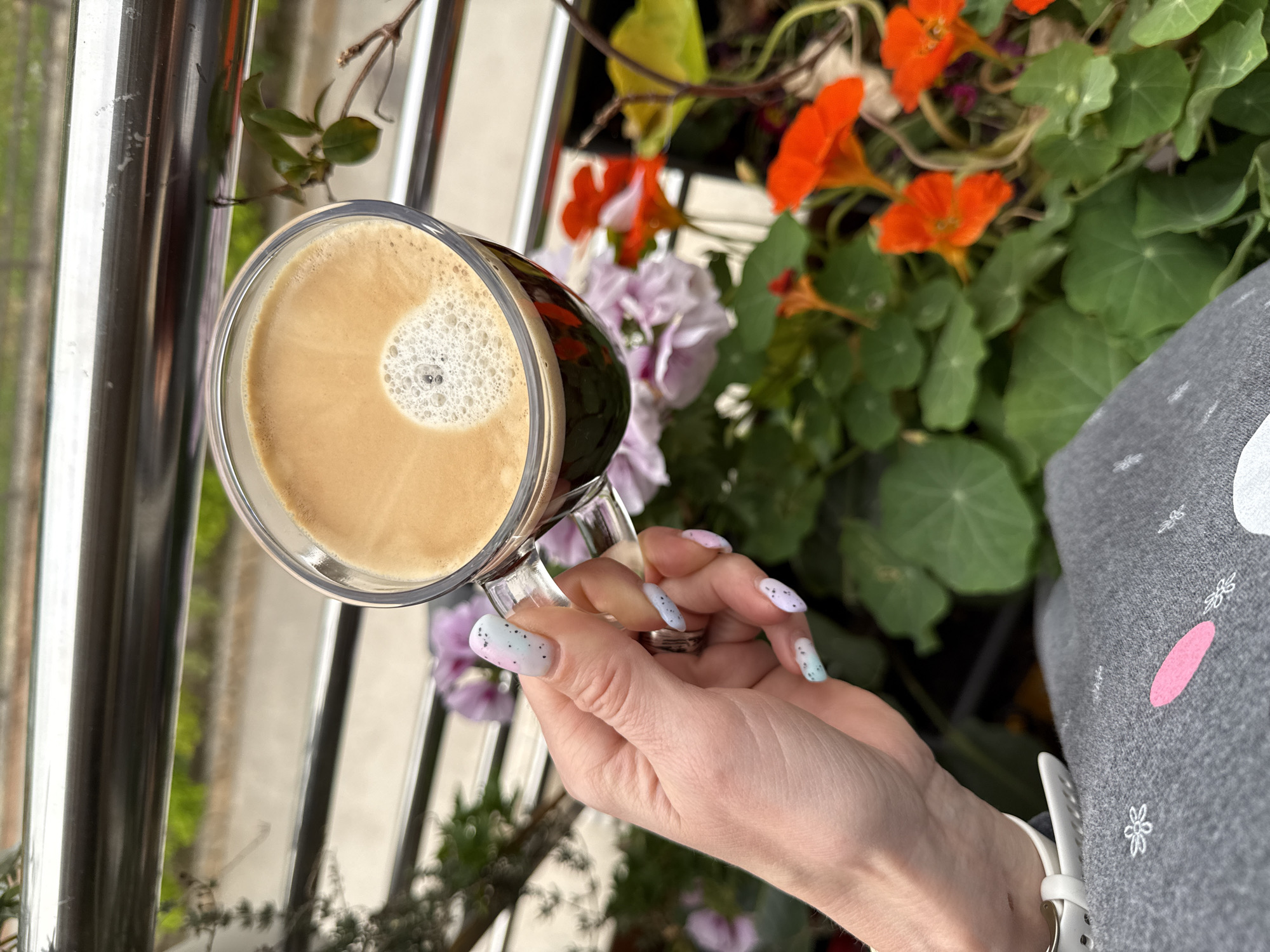 Woman enjoys morning coffee in coastal Montenegro village