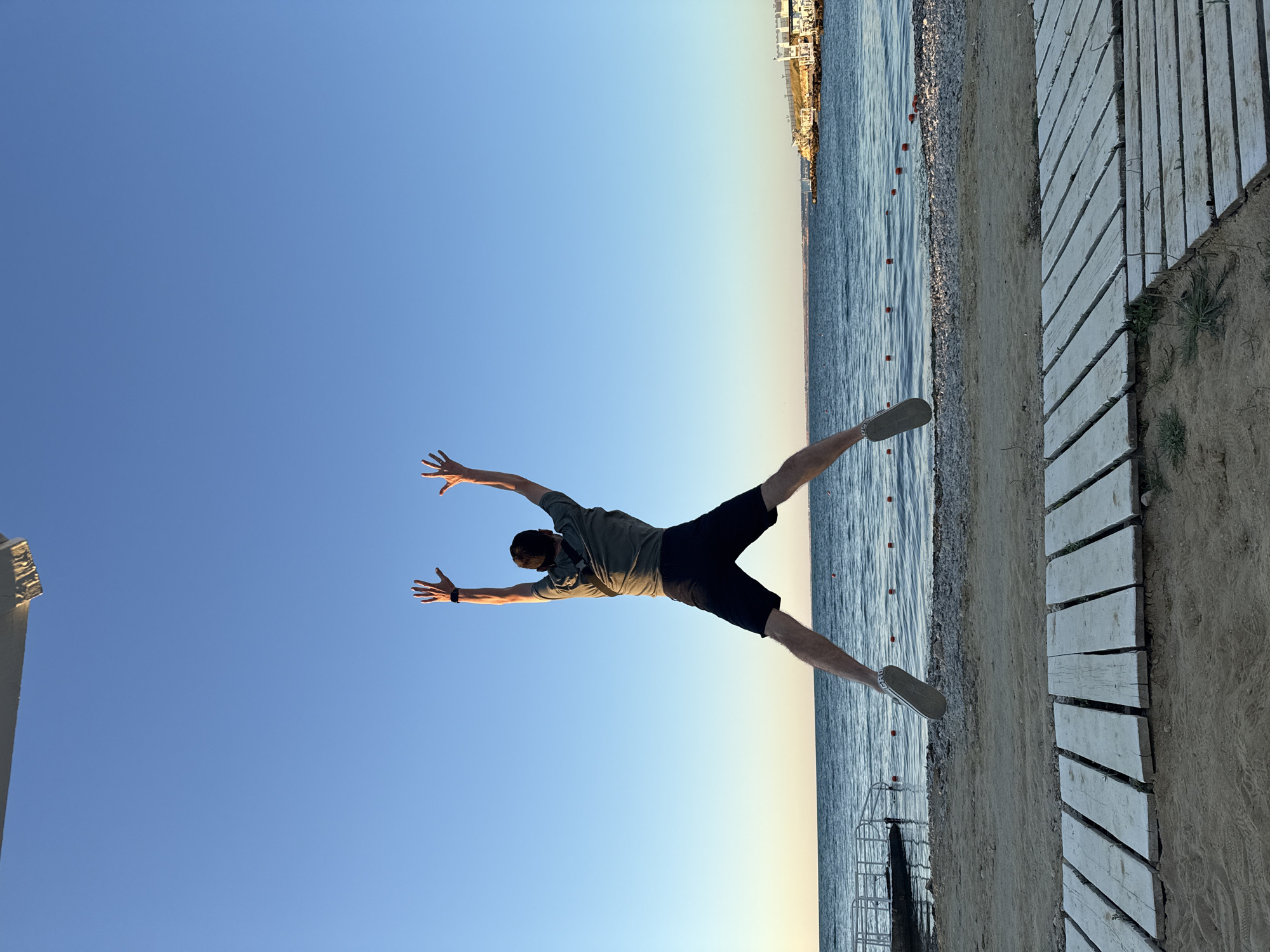 Beach resort afternoon turning to sunset with boardwalk activities