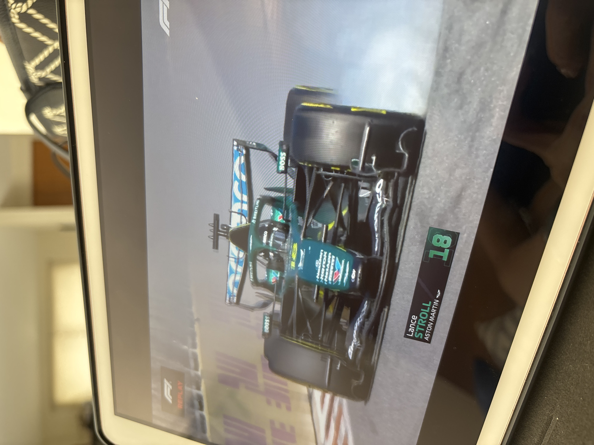 F1 replay showing Stroll's Aston Martin viewed in Puebla