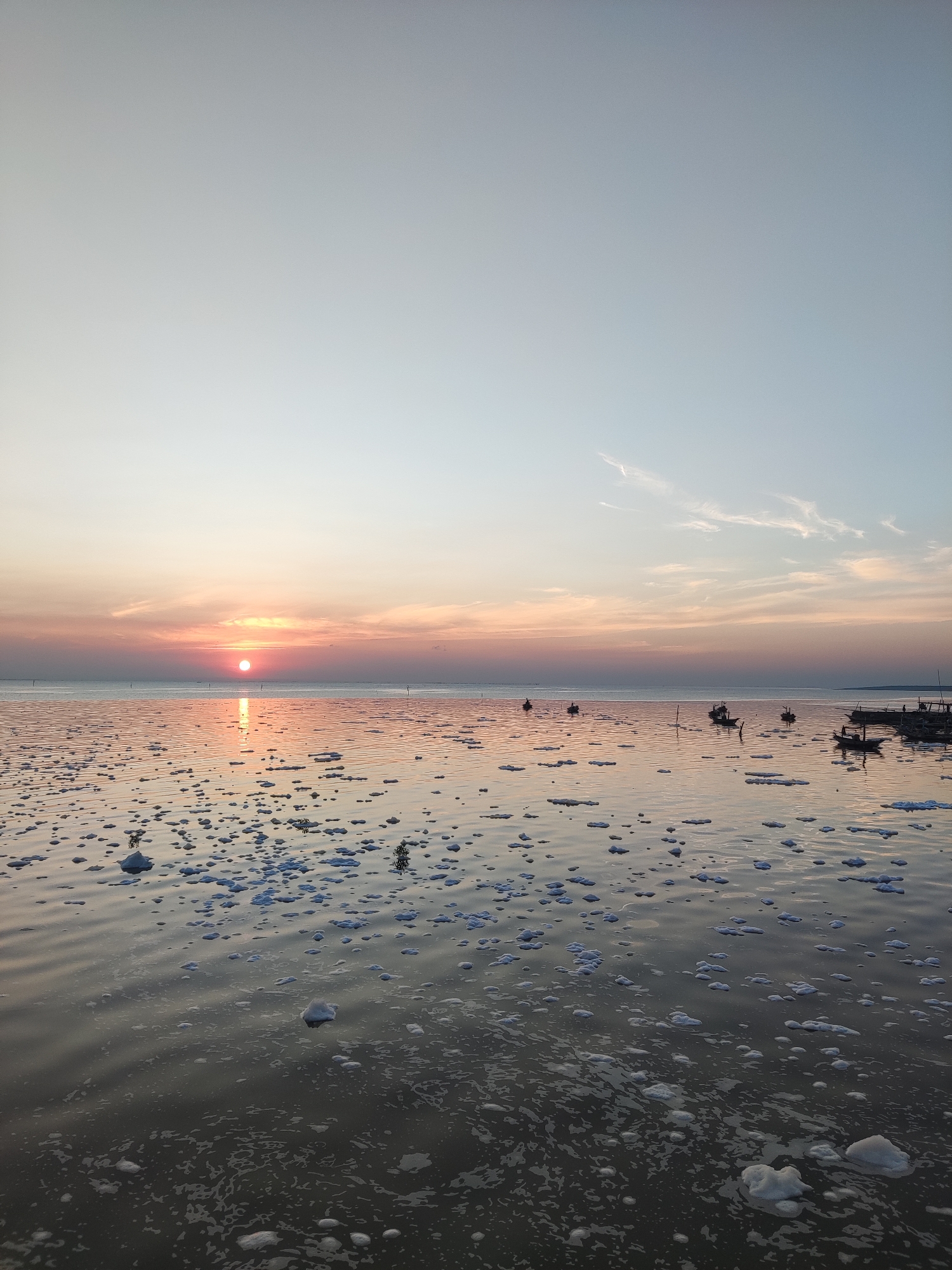 Sunset stroll along Surabaya's Suramadu Bridge waterfront