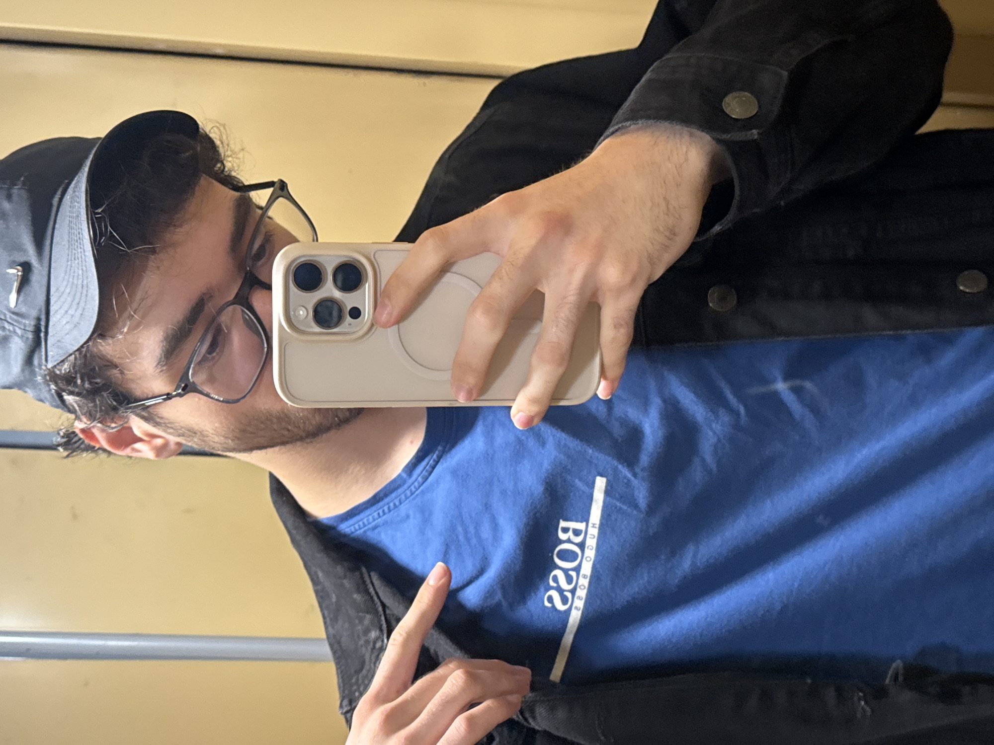 Young man takes selfie, poses indoors in Blagoevgrad