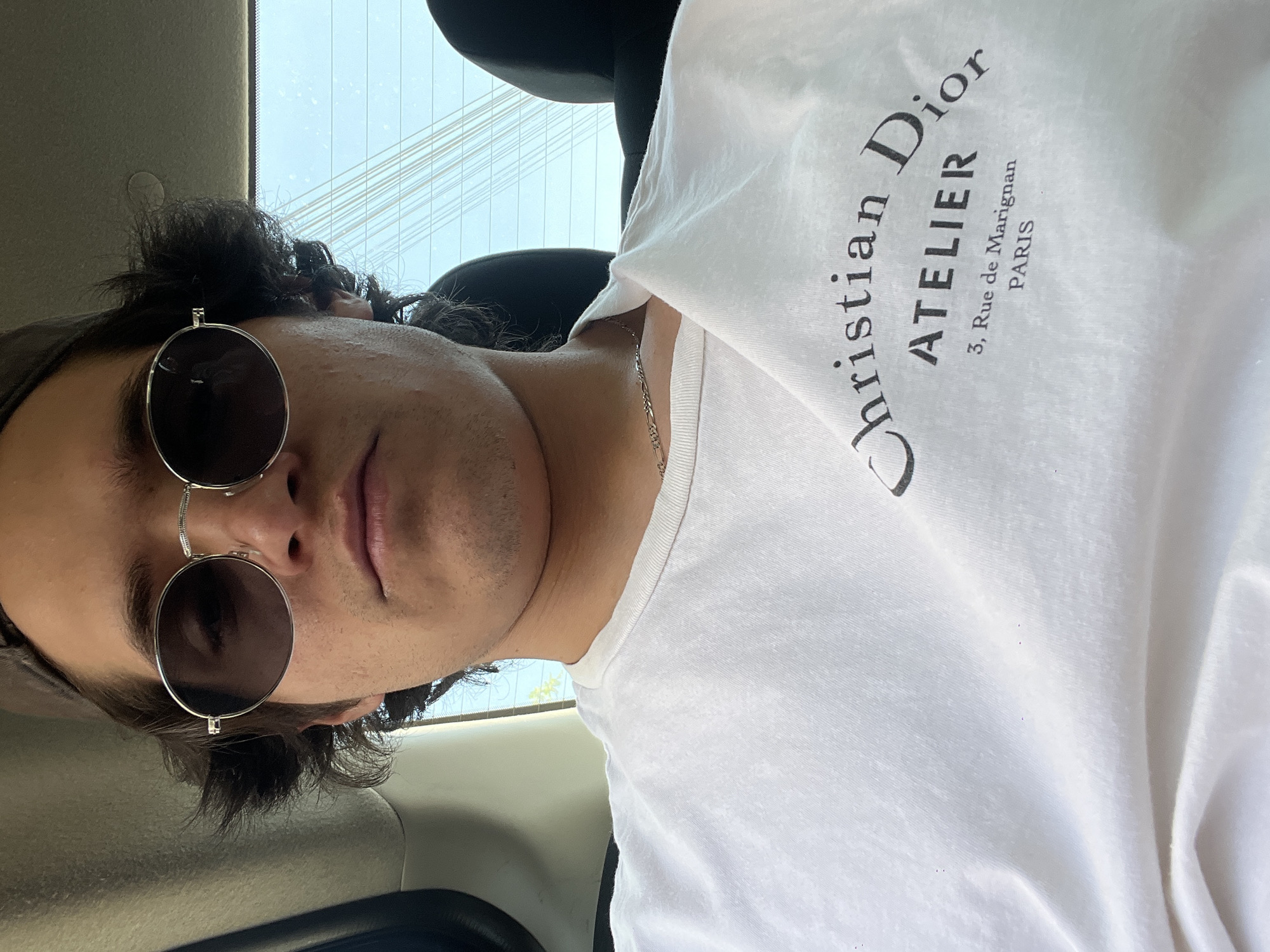 Young man photographed in vehicle interior, Mexico City