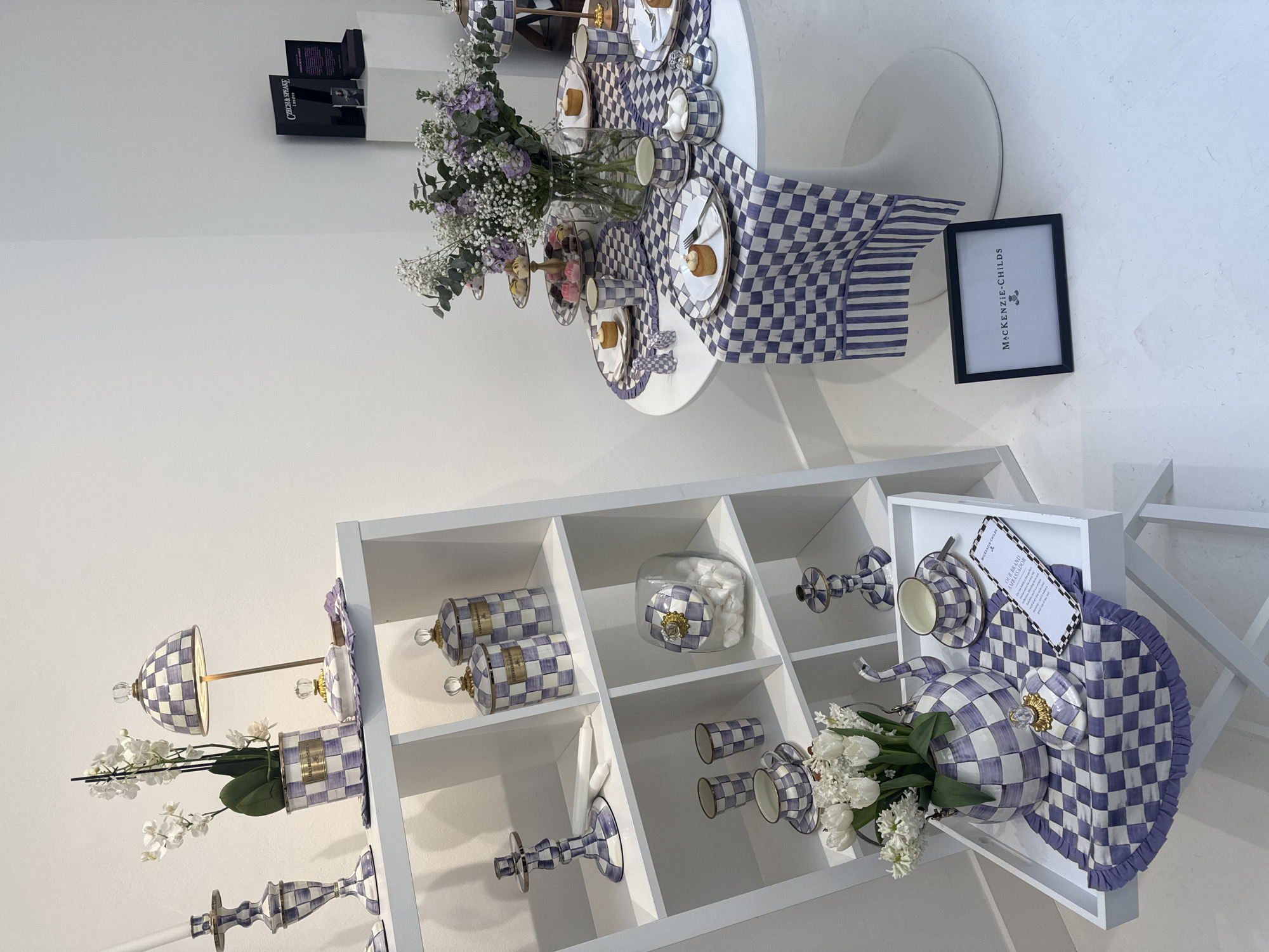 Purple checkered homeware display documented at London retail showroom