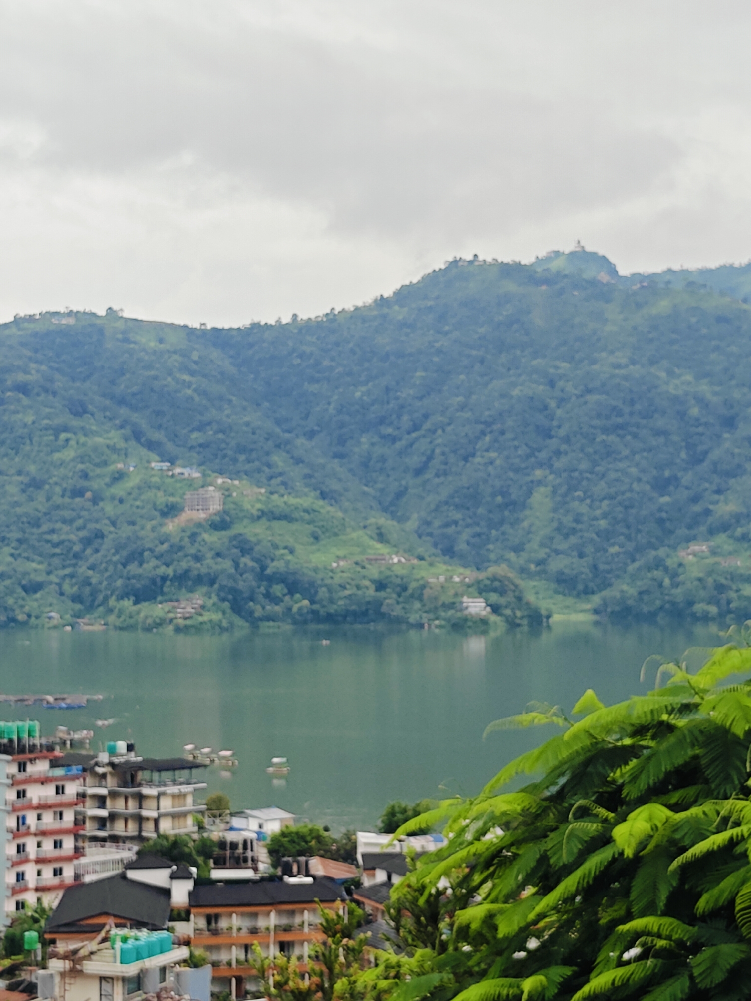Elevated views over Phewa Lake and Pokhara under overcast skies