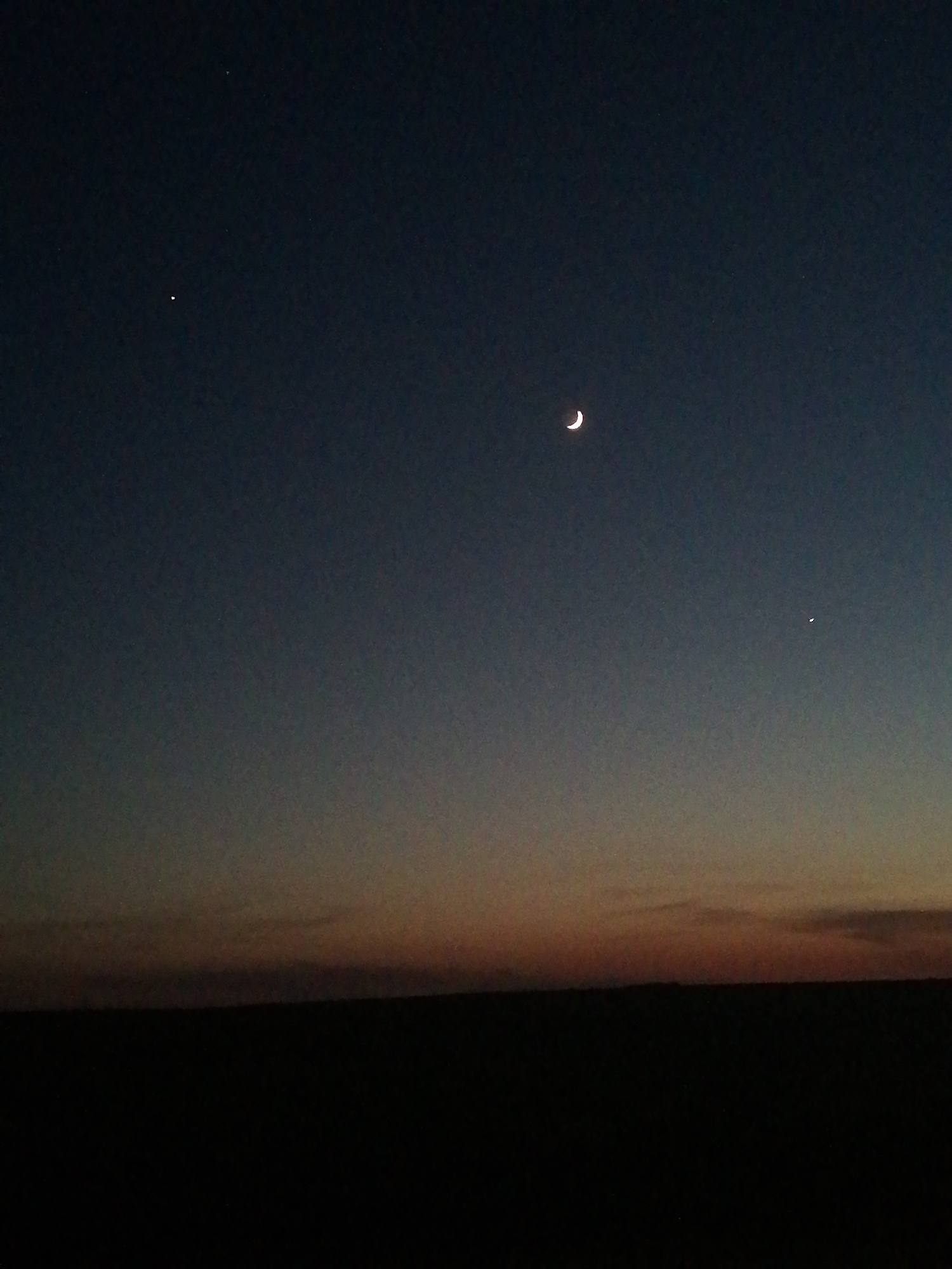 Night sky observation shows crescent moon, celestial objects