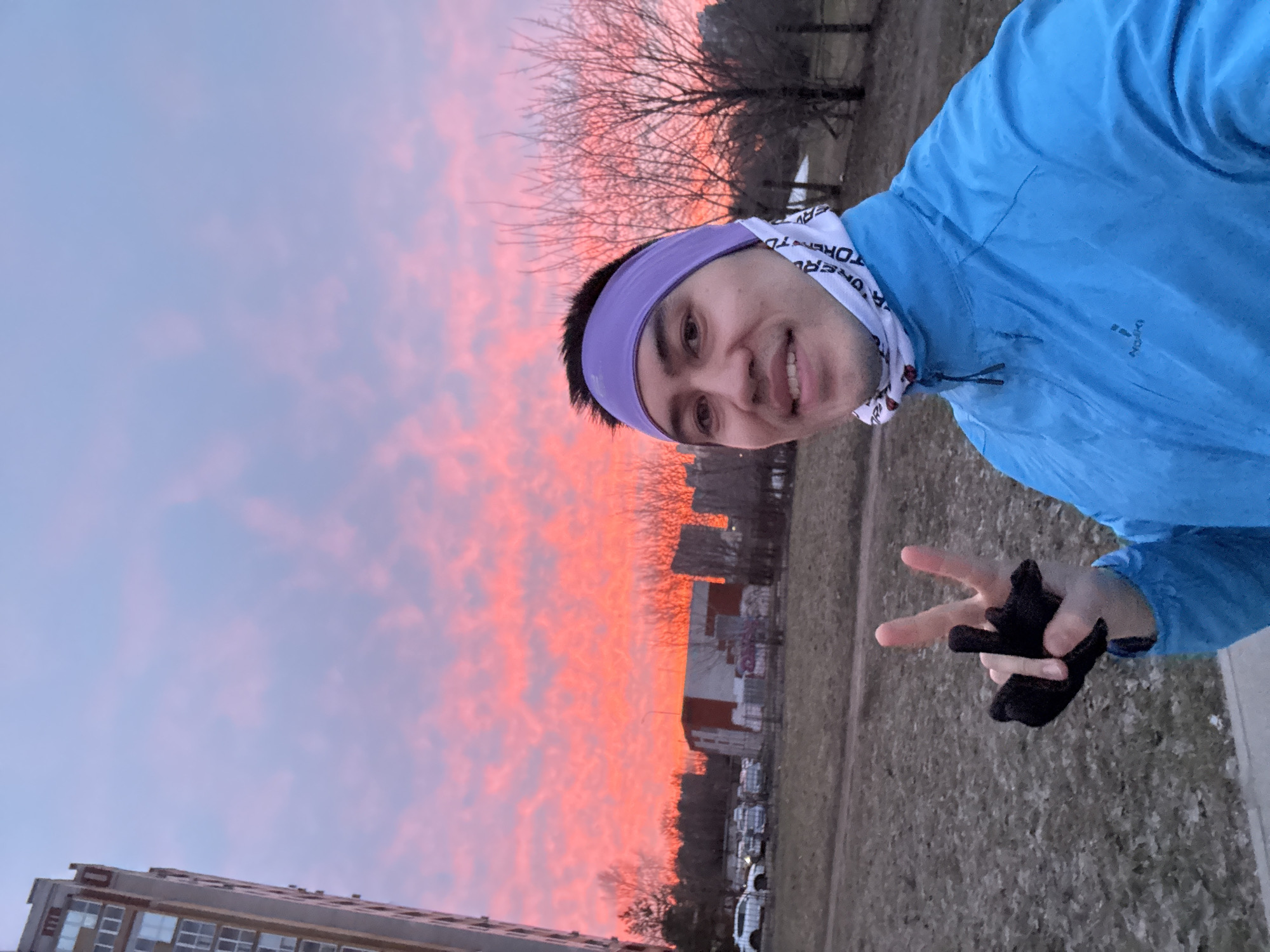 Person poses for peace sign selfie in Chistoe Ozero