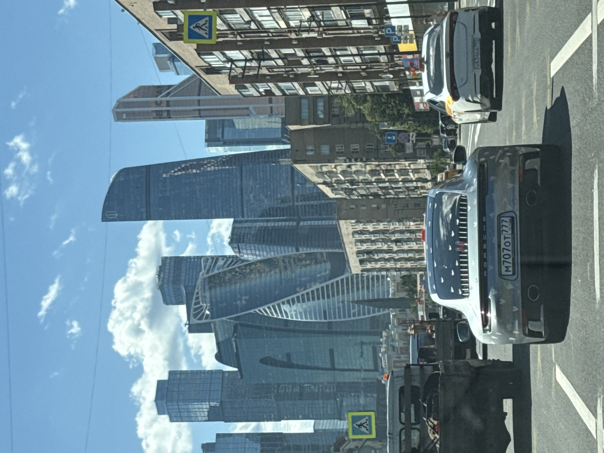 Silver Porsche 911 cruising through Moscow city streets