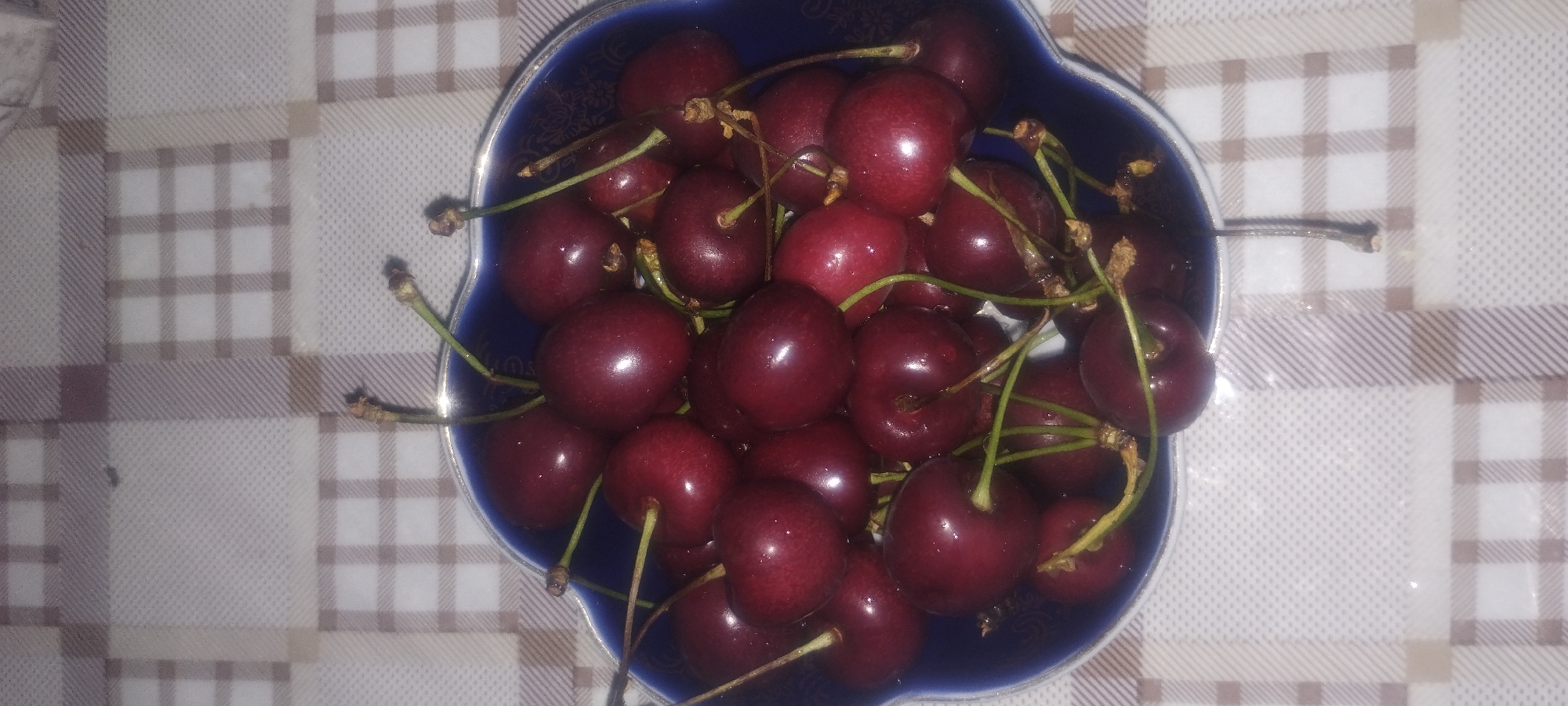 Cherries, snacks, and zucchini rolls in one food spread