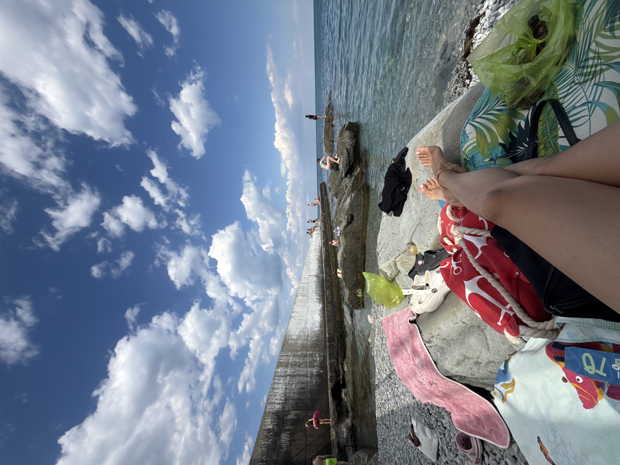 A relaxed summer day on the rocky shores of Partenit