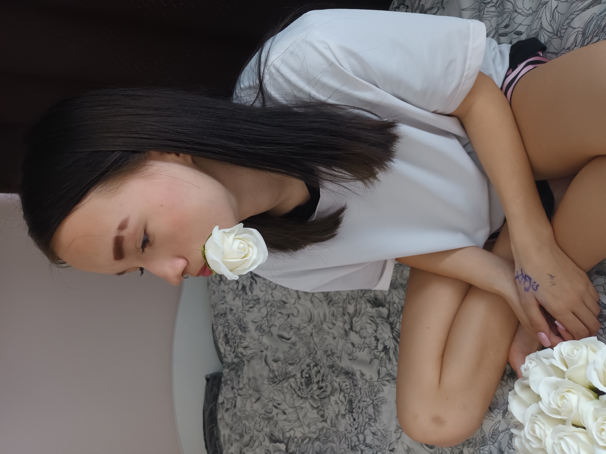 Woman conducts morning photo session with roses in Russia